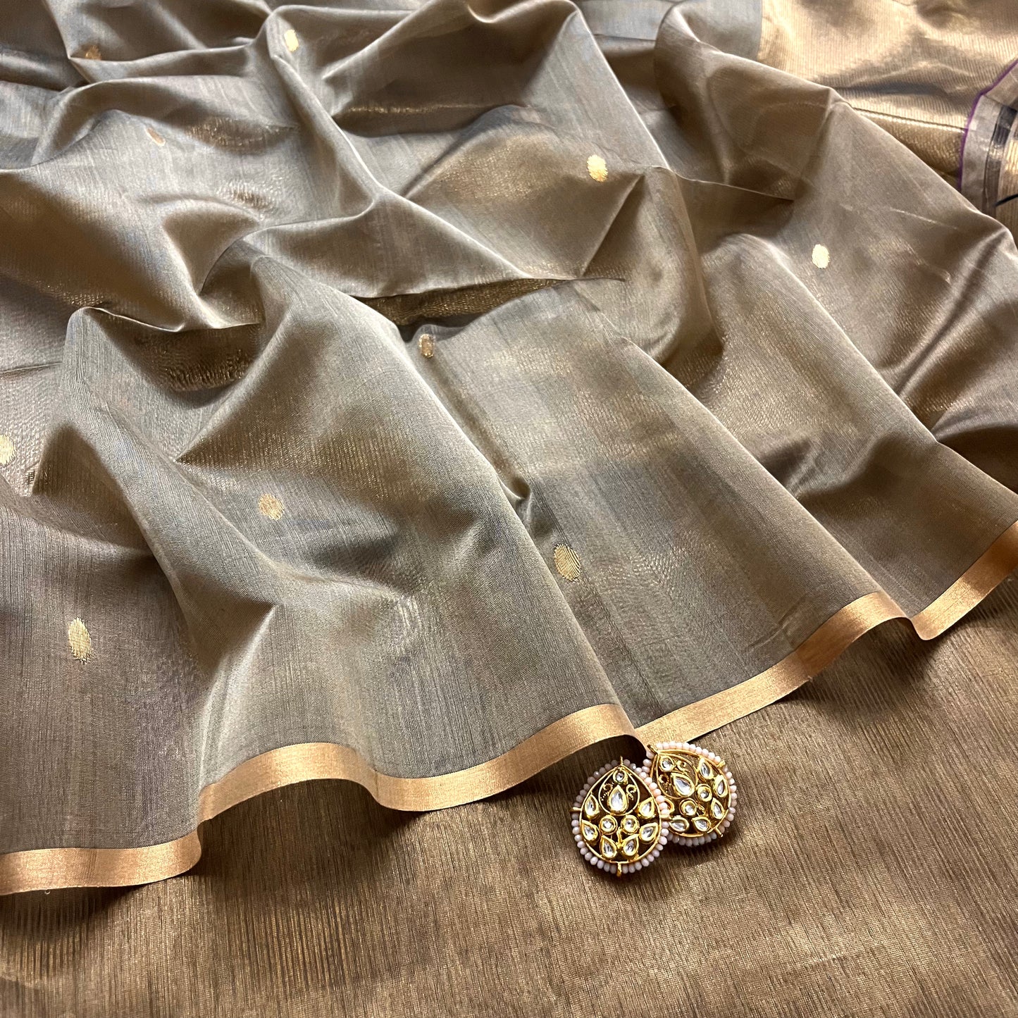 Antique gold maheshwari saree with zari bootis and zari lines