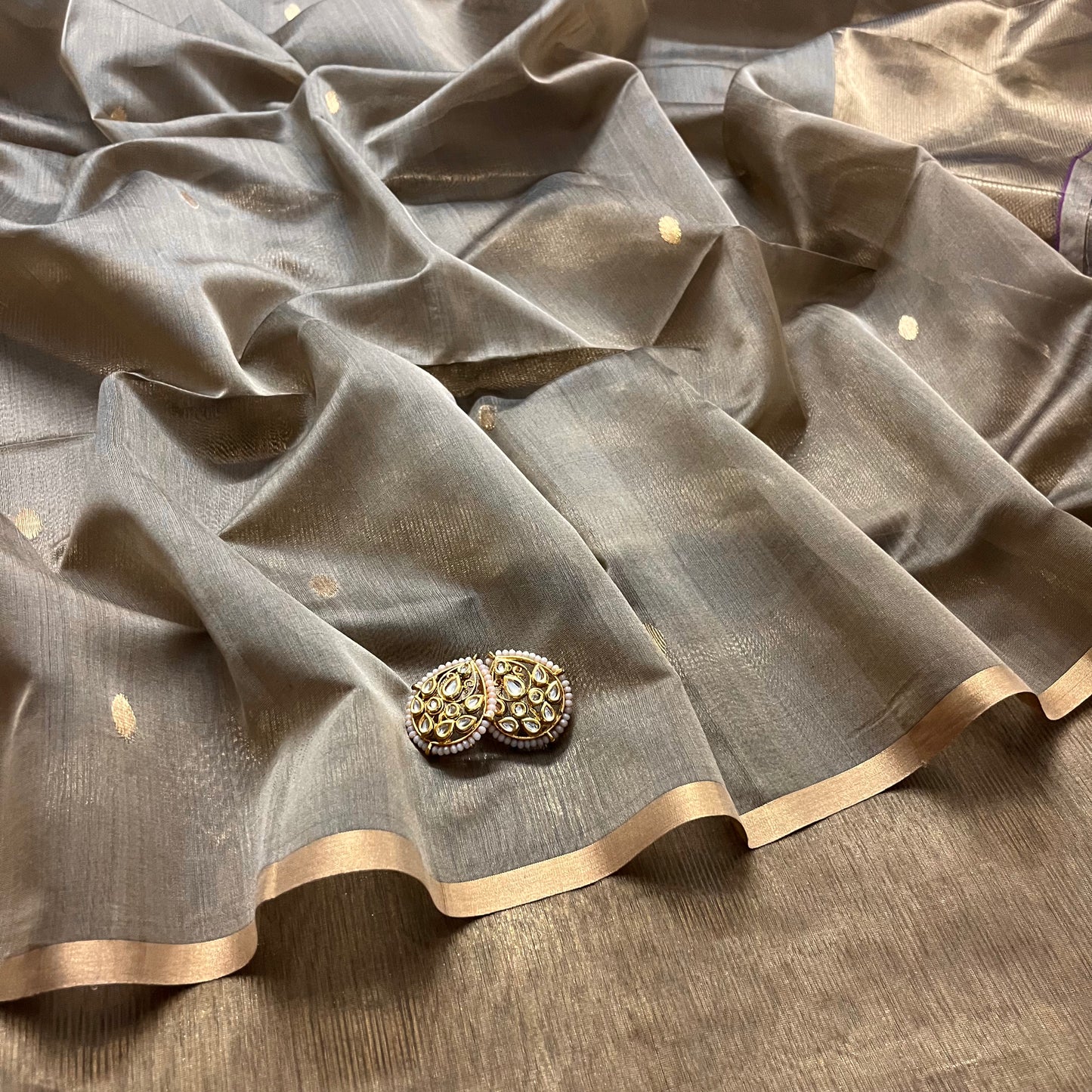 Antique gold maheshwari saree with zari bootis and zari lines
