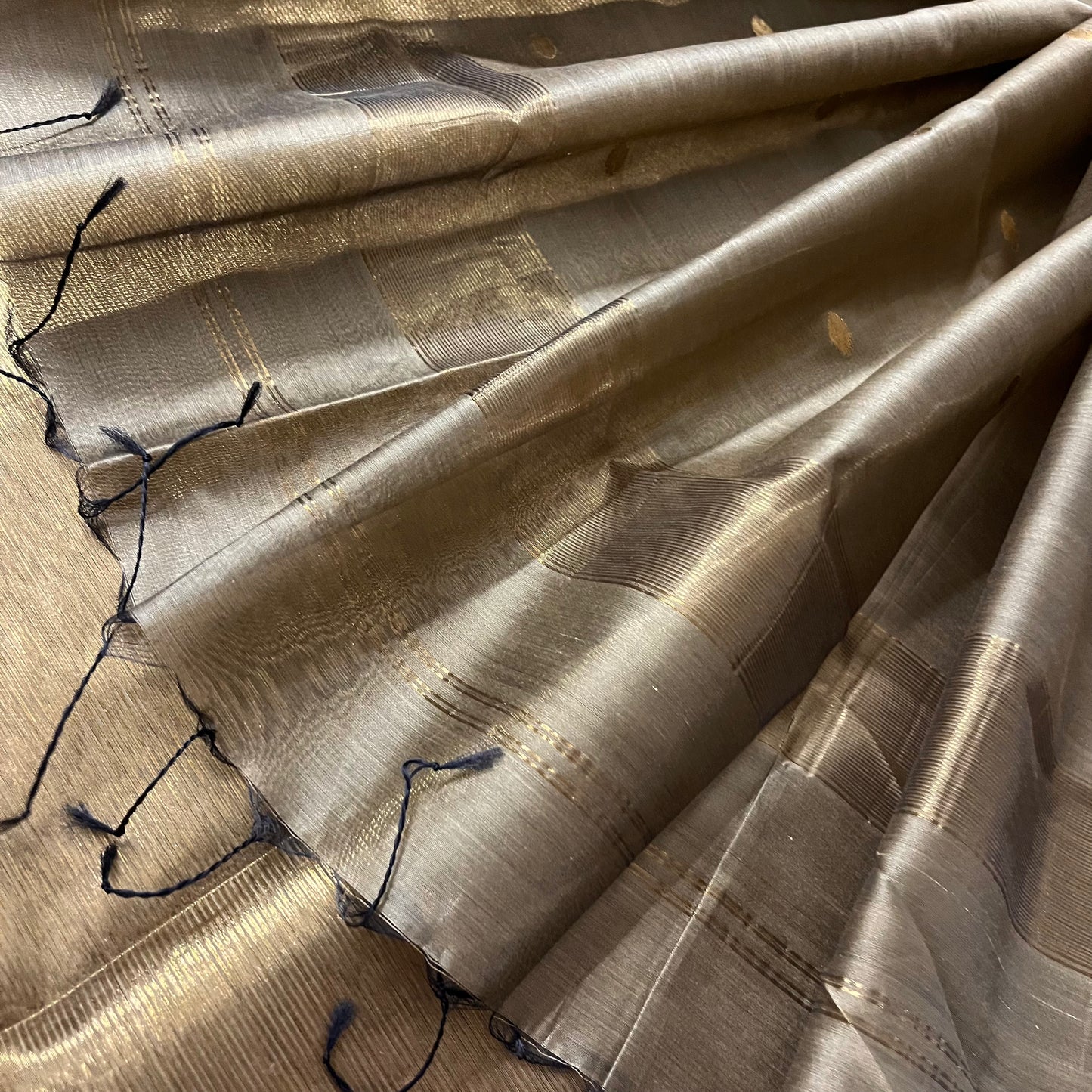 Antique gold maheshwari saree with zari bootis and zari lines