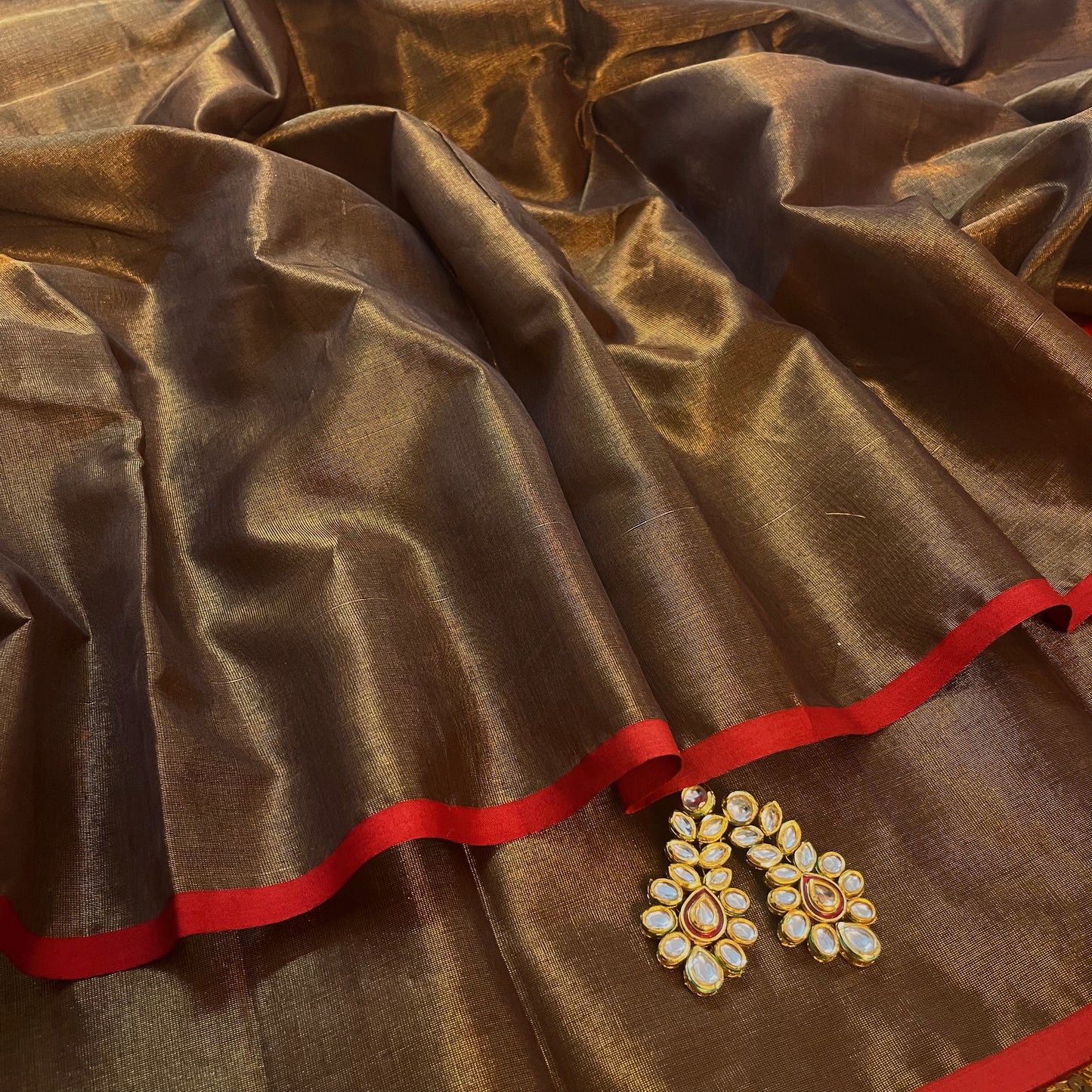 Bronze gold & red maheshwari tissue silk saree with zari lines on pallu