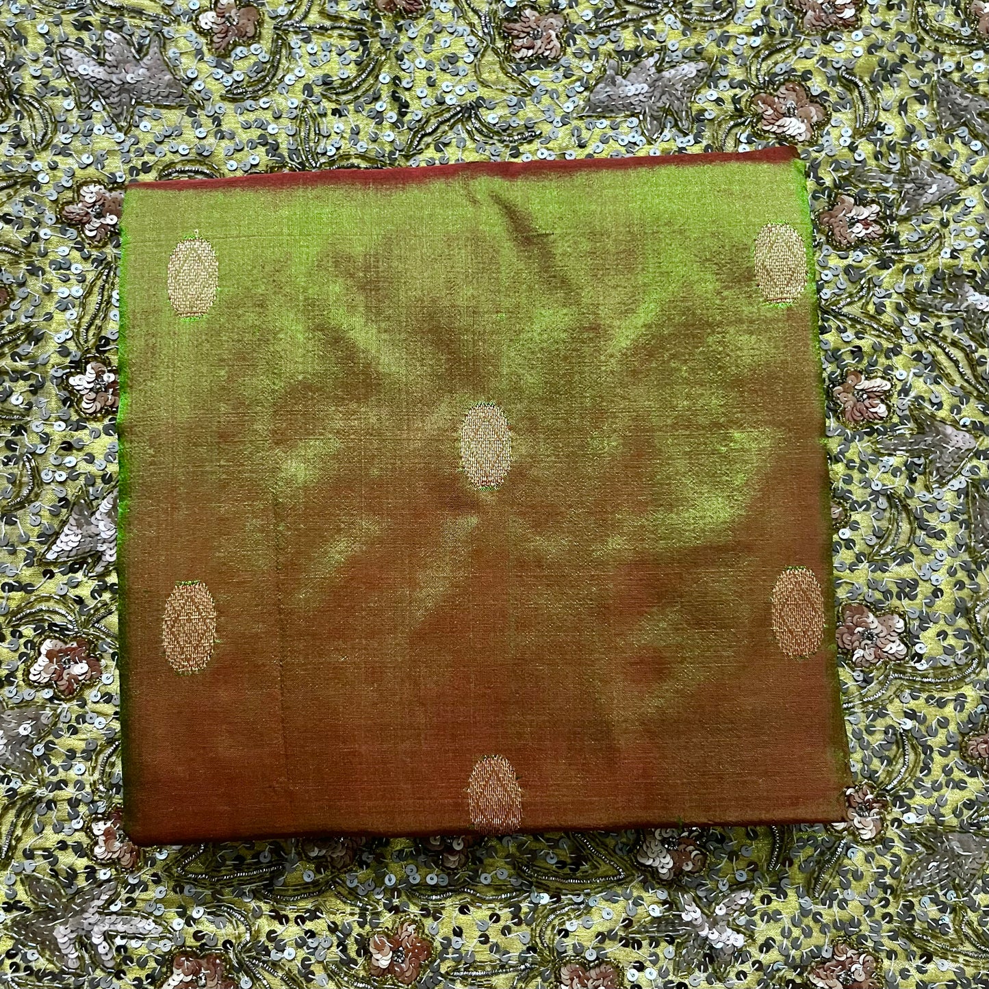 Olive green and red Maheshwari silk saree with zari bootis all over