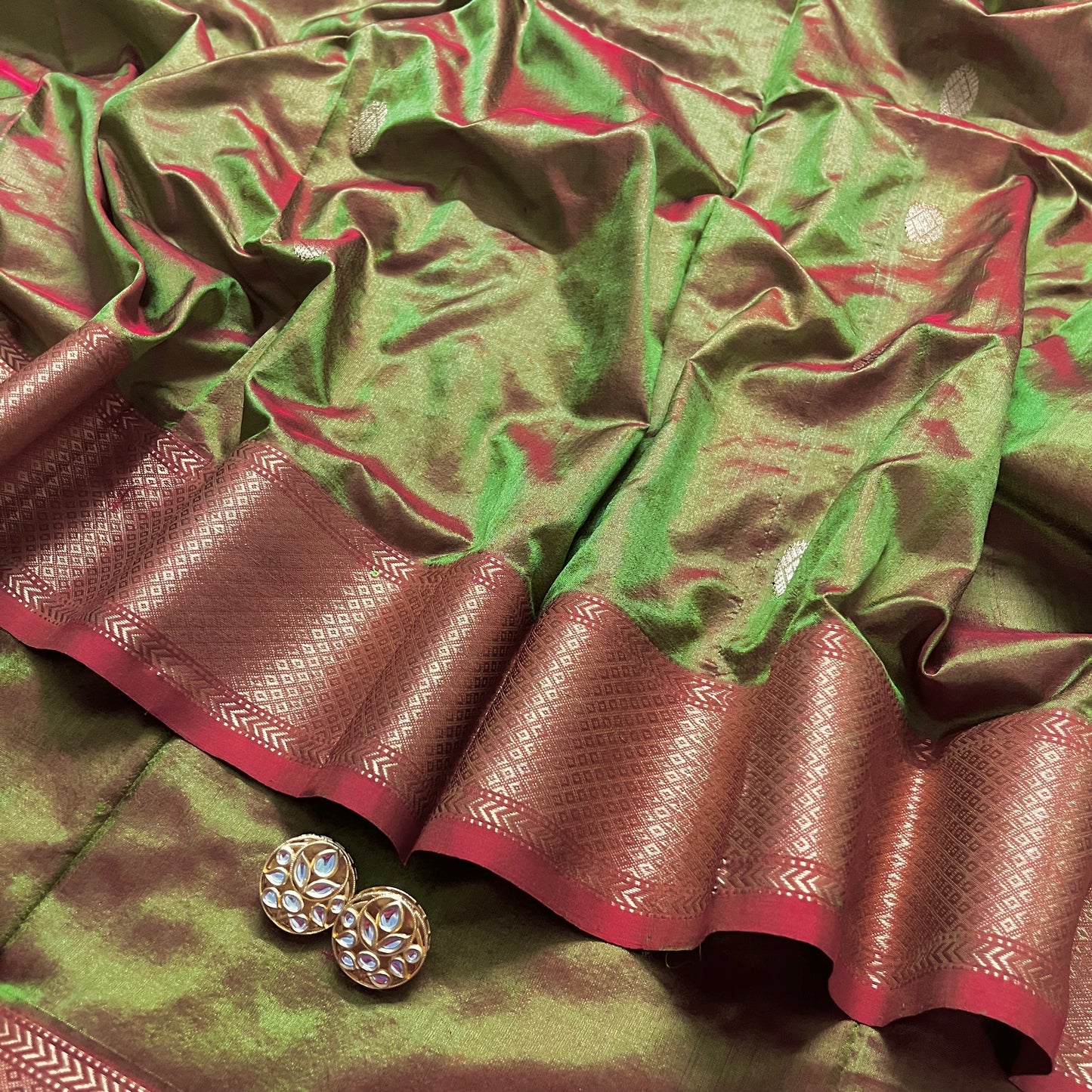 Olive green and red Maheshwari silk saree with zari bootis all over