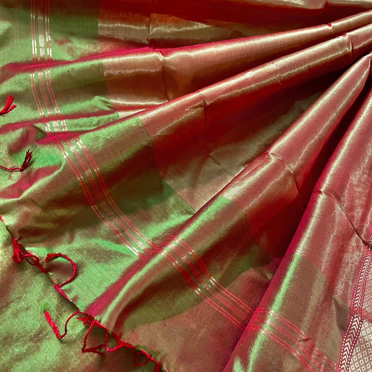 Olive green and red Maheshwari silk saree with zari bootis all over