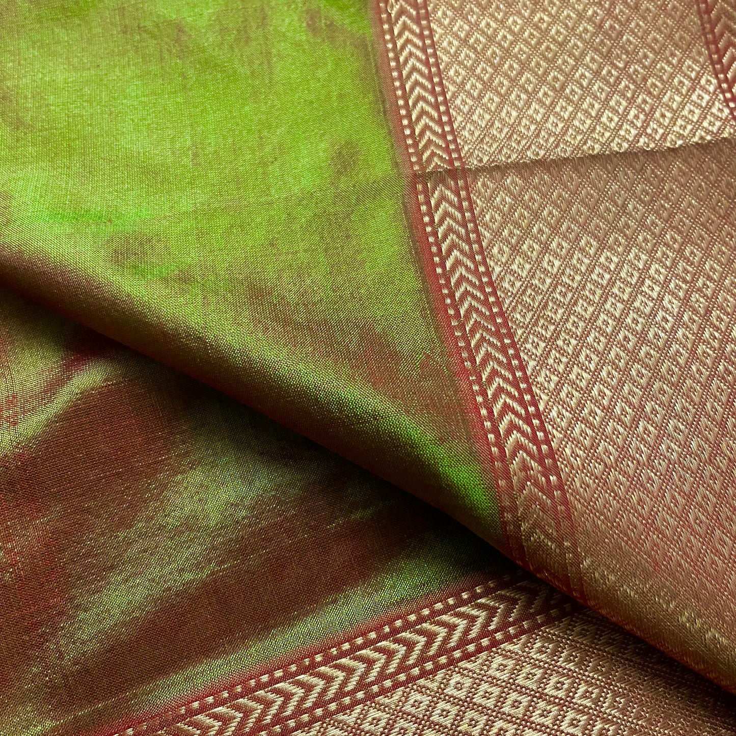 Olive green and red Maheshwari silk saree with zari bootis all over