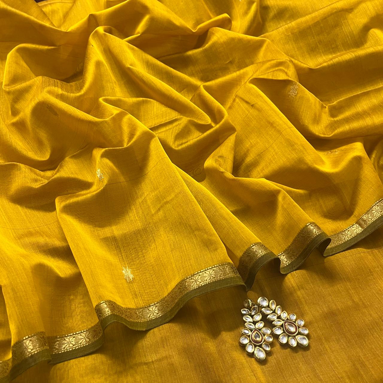 Mustard and pink maheshwari saree with flower bootis all over