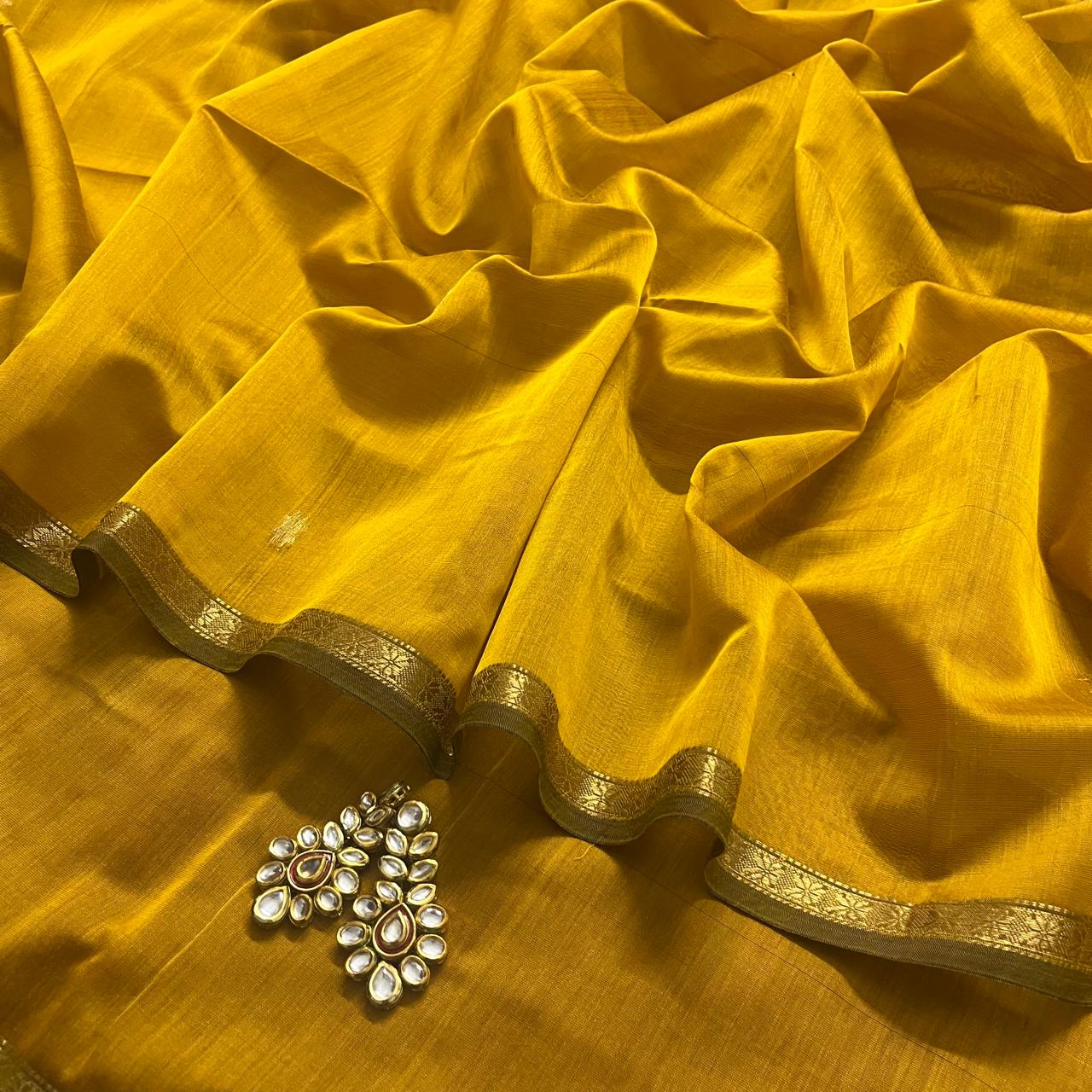 Mustard and pink maheshwari saree with flower bootis all over