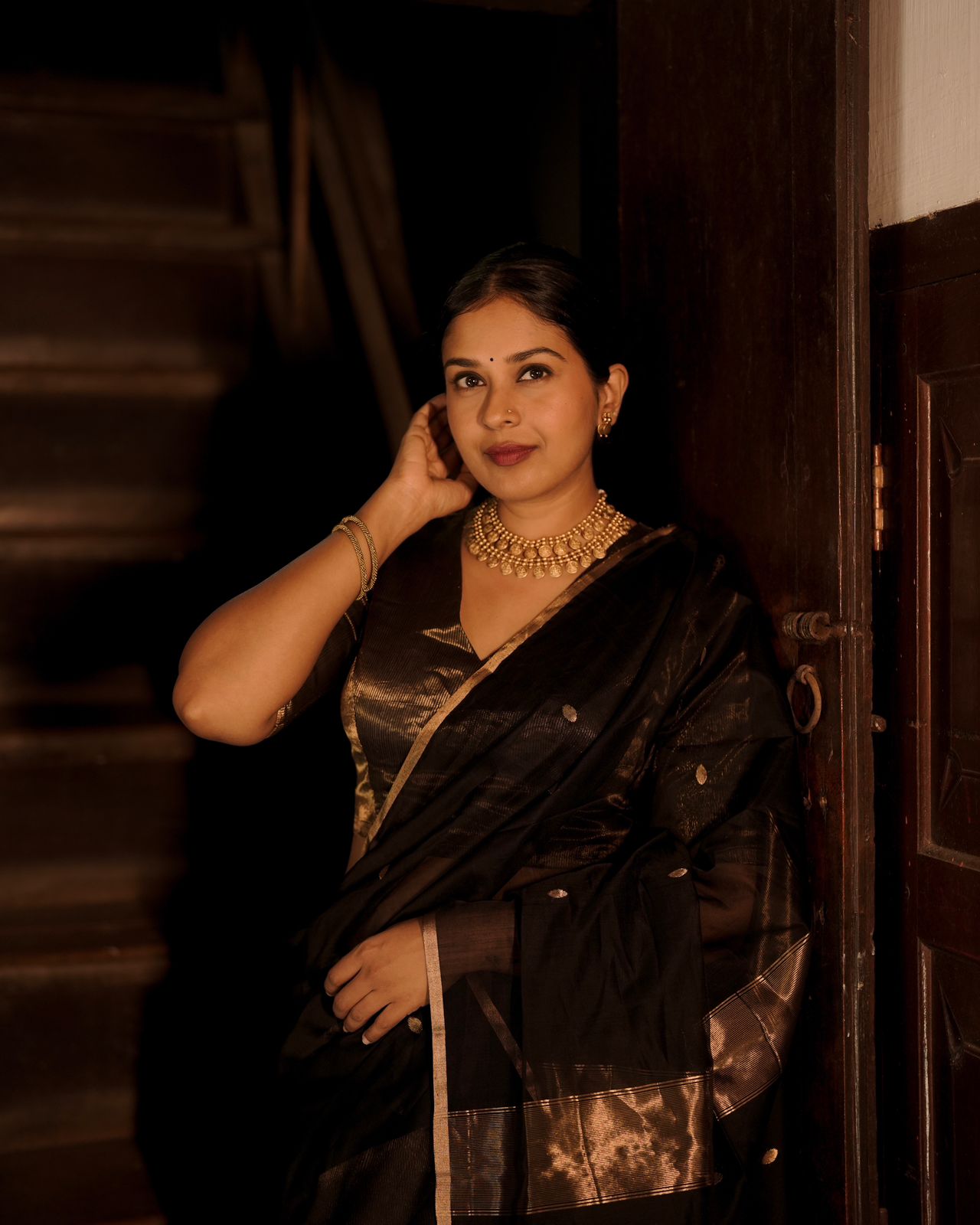 Black and gold maheshwari saree with zari bootis and zari lines all over