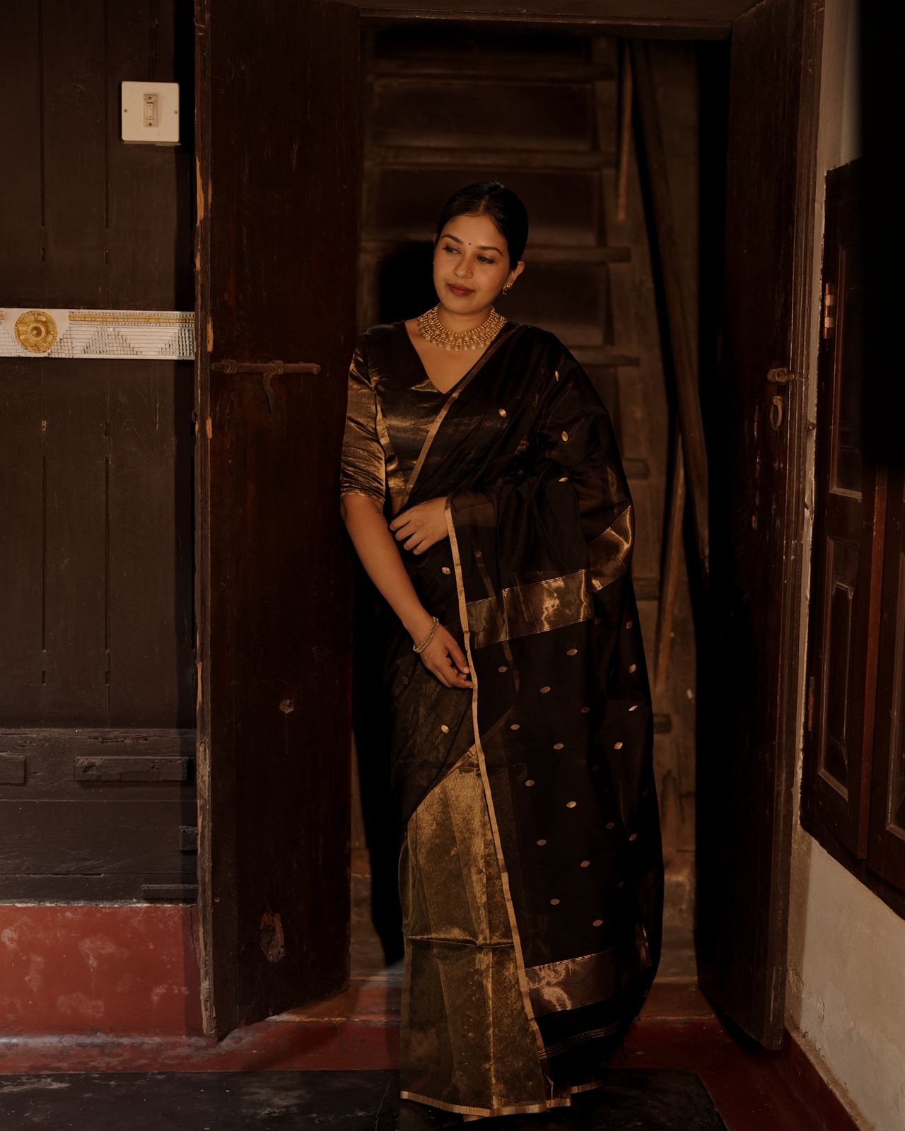 Black and gold maheshwari saree with zari bootis and zari lines all over