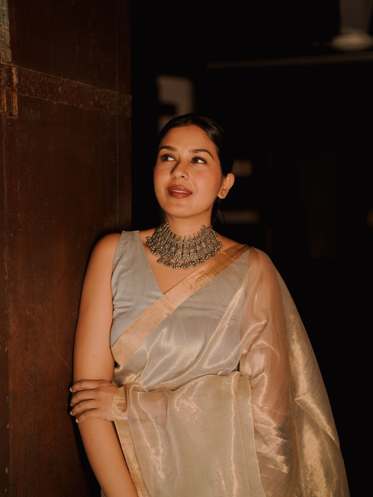 Grey and gold Maheshwari saree with zari lines all over