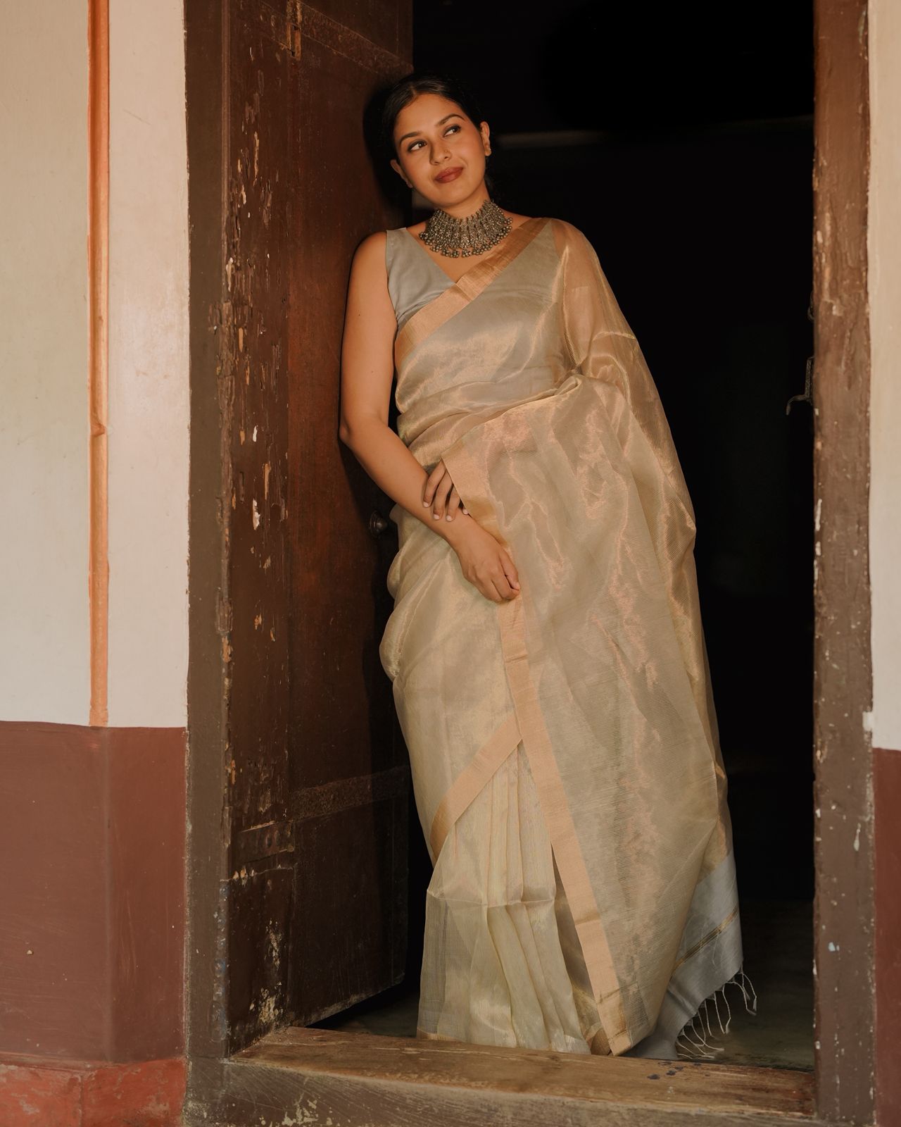 Grey and gold Maheshwari saree with zari lines all over