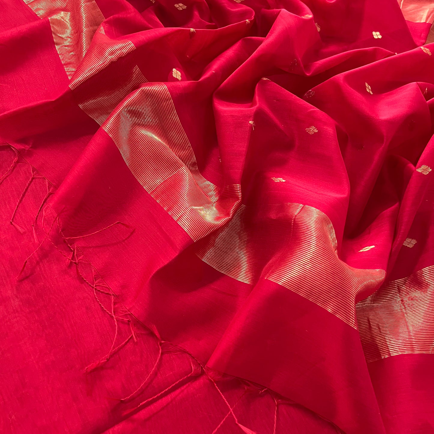 Deep red maheshwari saree with zari bootis all over