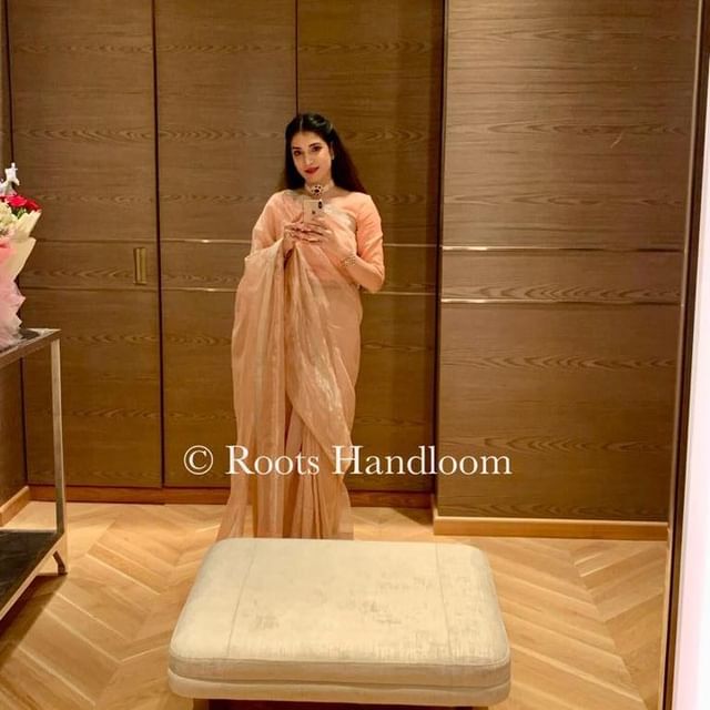 Peachish Pink Maheshwari saree with Silver Zari lines all over