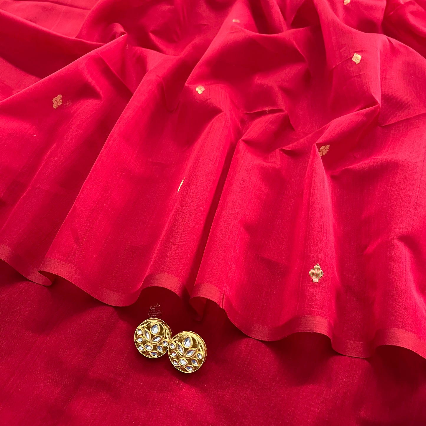 Deep red maheshwari saree with zari bootis all over