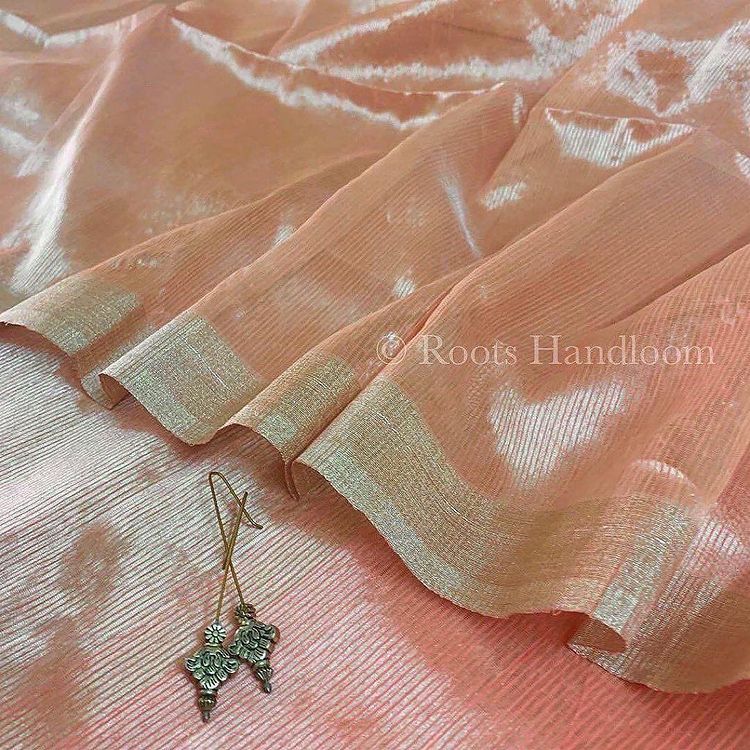 Peachish Pink Maheshwari saree with Silver Zari lines all over