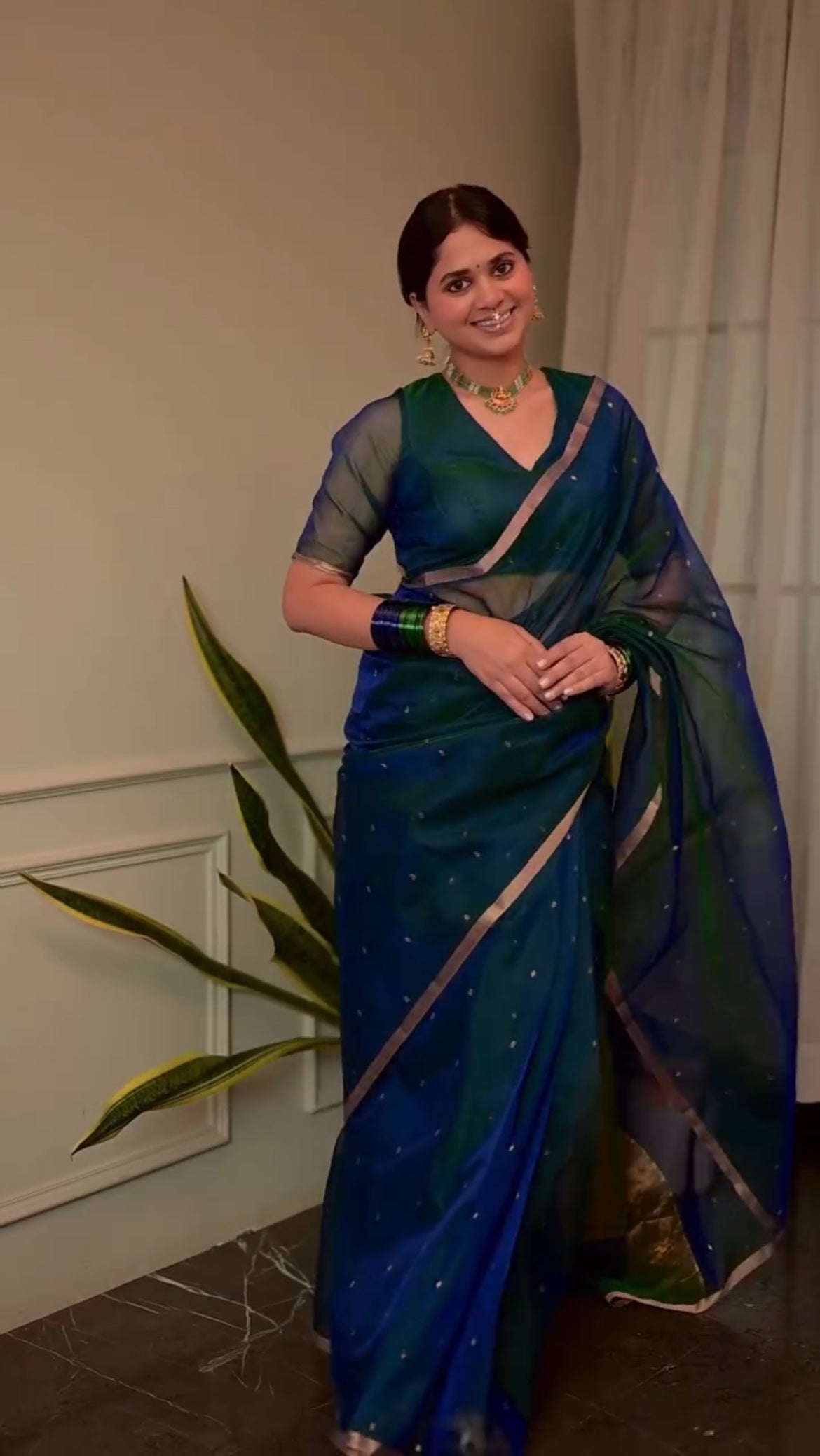 Peacock blue and green dual tone Chanderi organza silk saree with zari bootis all over