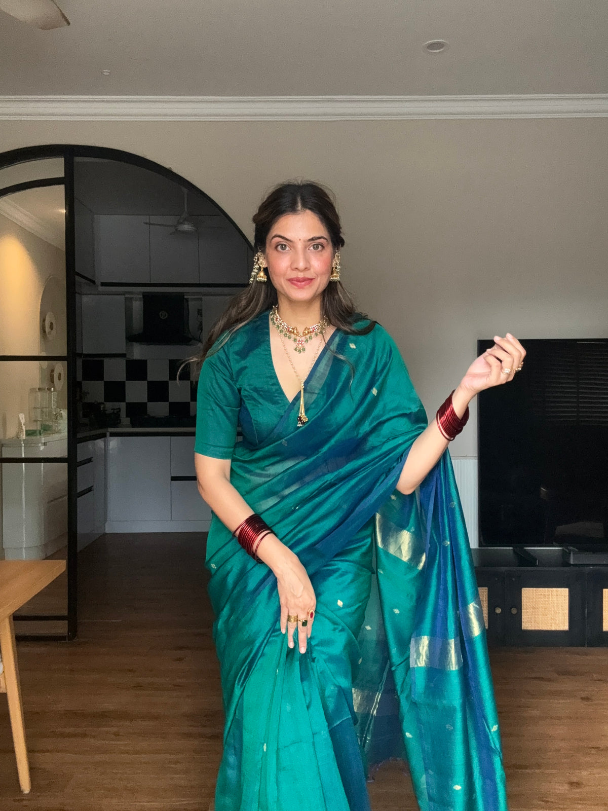 Peacock green and blue dual tone Maheshwari saree with zari bootis all over