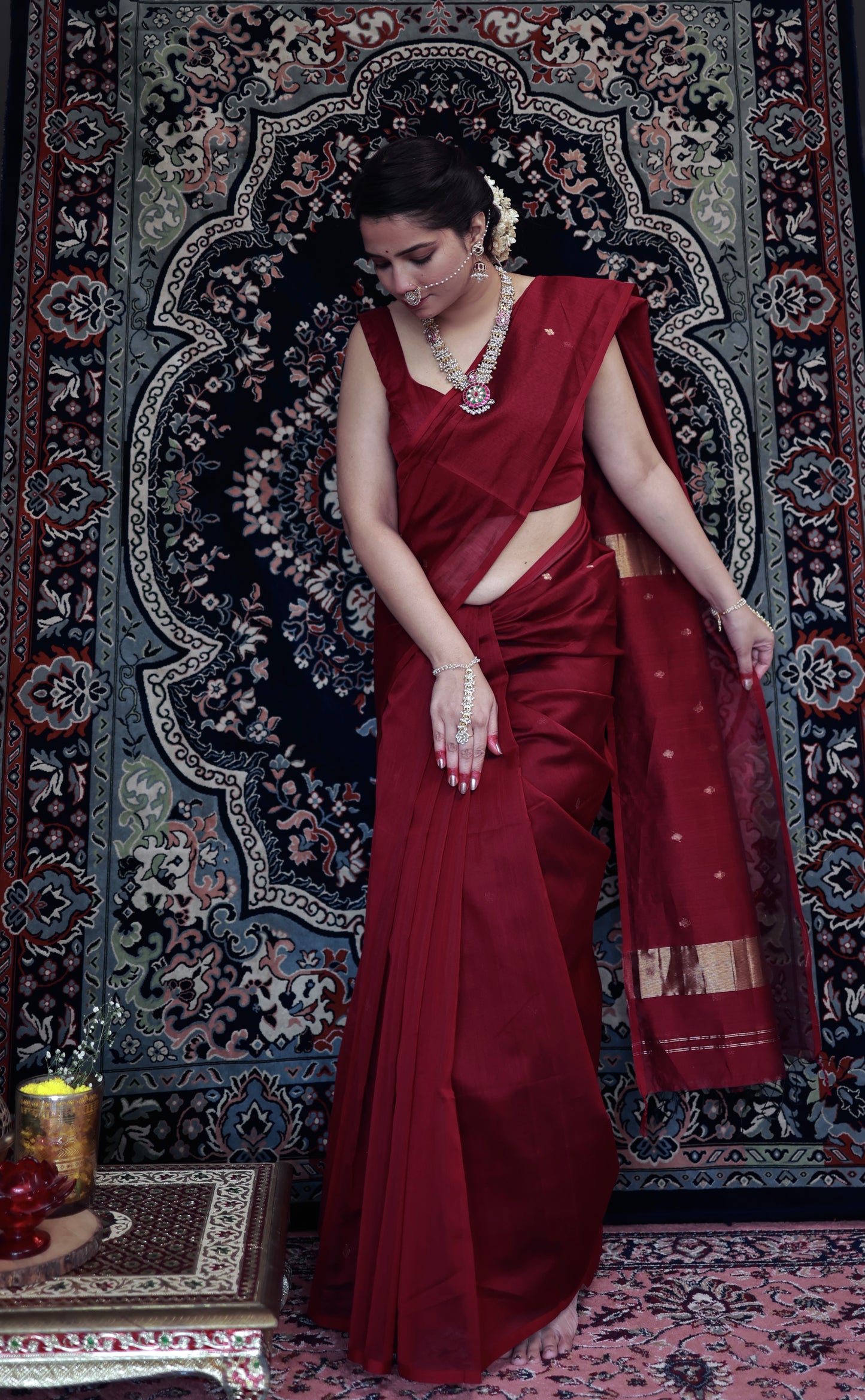 Deep maroon Maheshwari saree with zari bootis all over