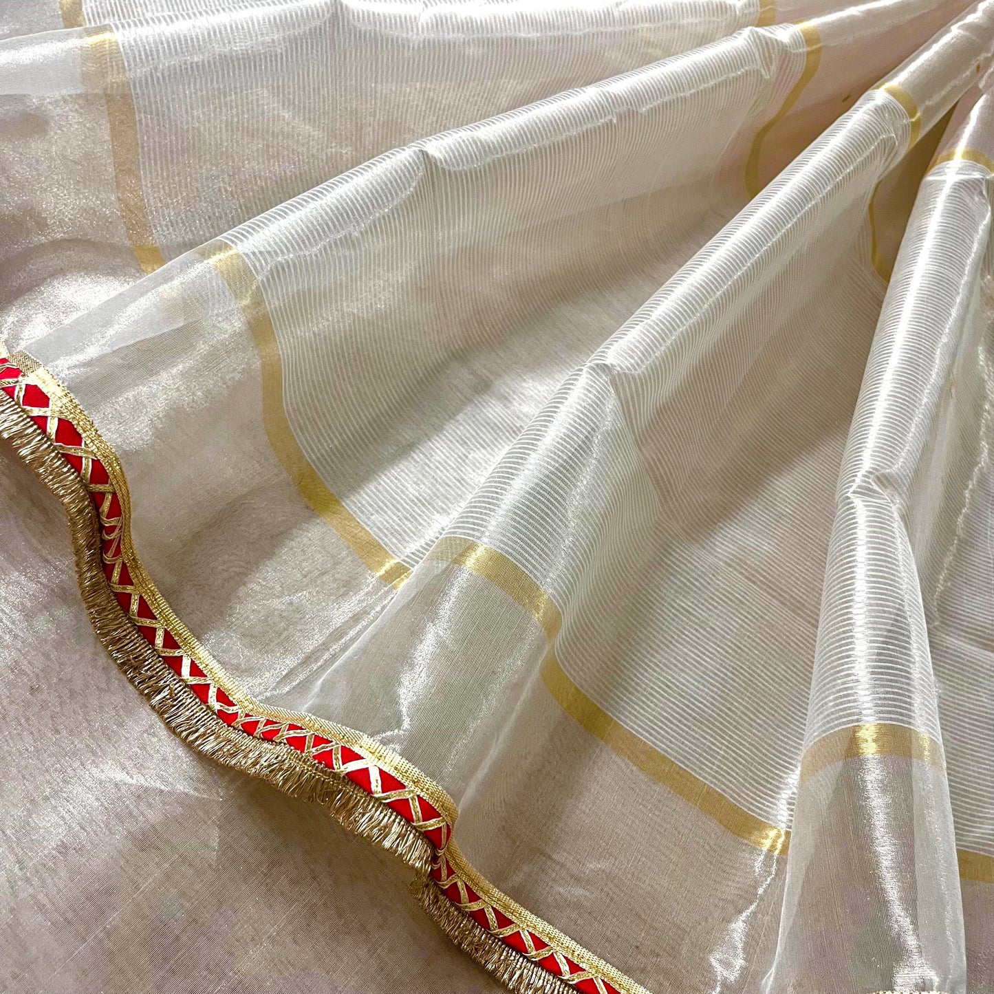 Chantilly cream and red Chanderi tissue silk saree with zari bootis all over