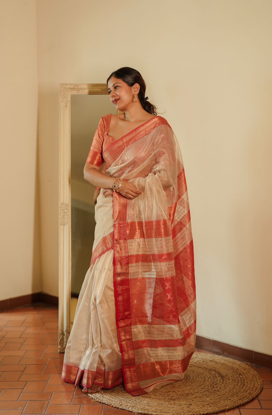 Cream and red Maheshwari tissue silk saree with zari pattern on pallu