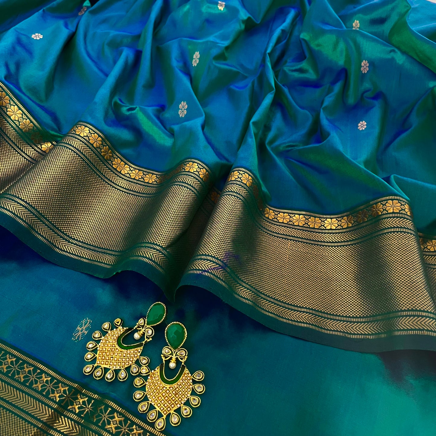 Peacock blue dual tone Maheshwari silk saree with flower bootis all over