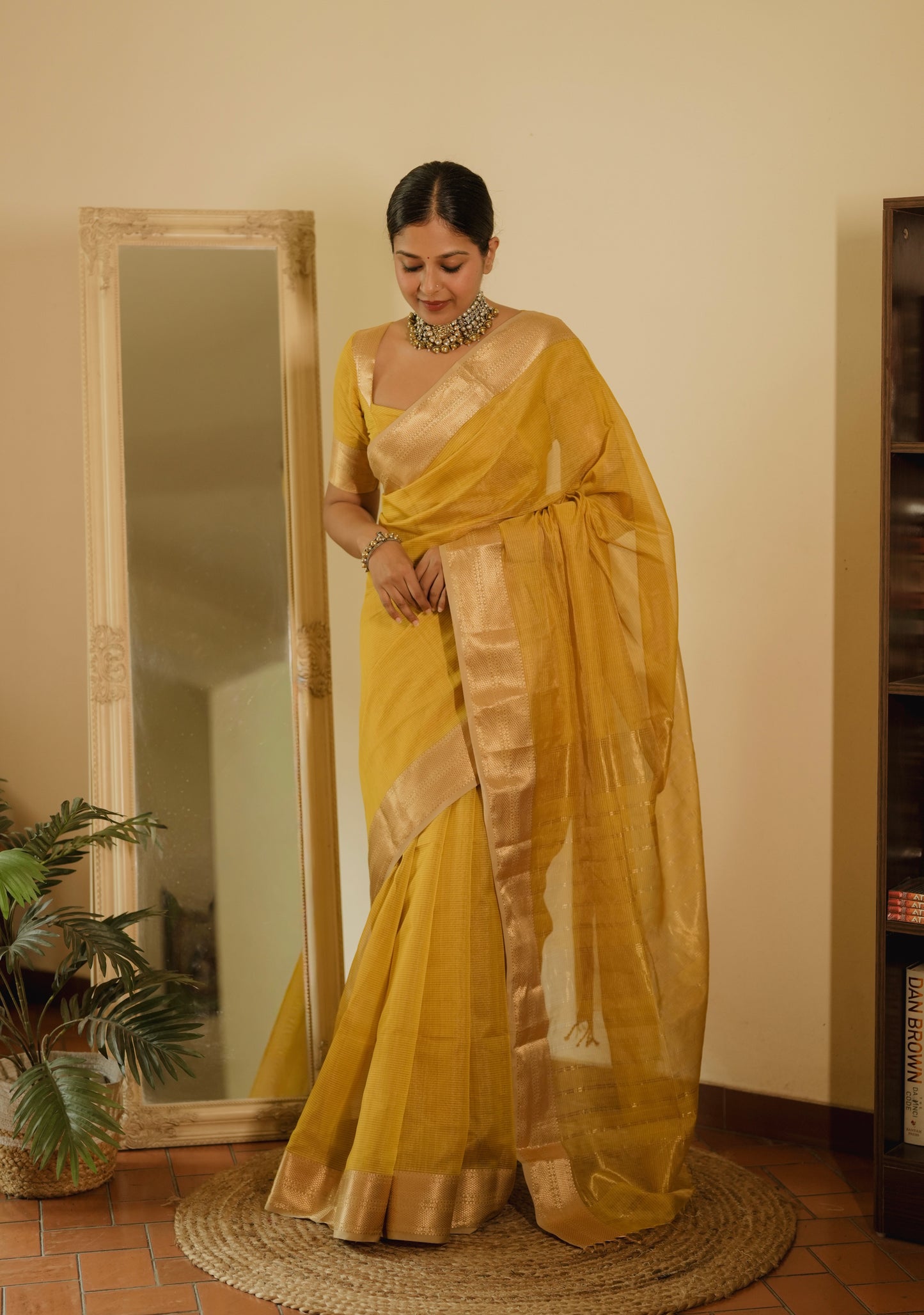 Yellow Maheshwari saree with zari lines all over