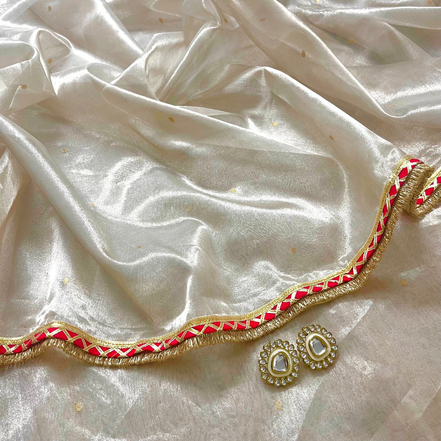 Chantilly cream and red Chanderi tissue silk saree with zari bootis all over