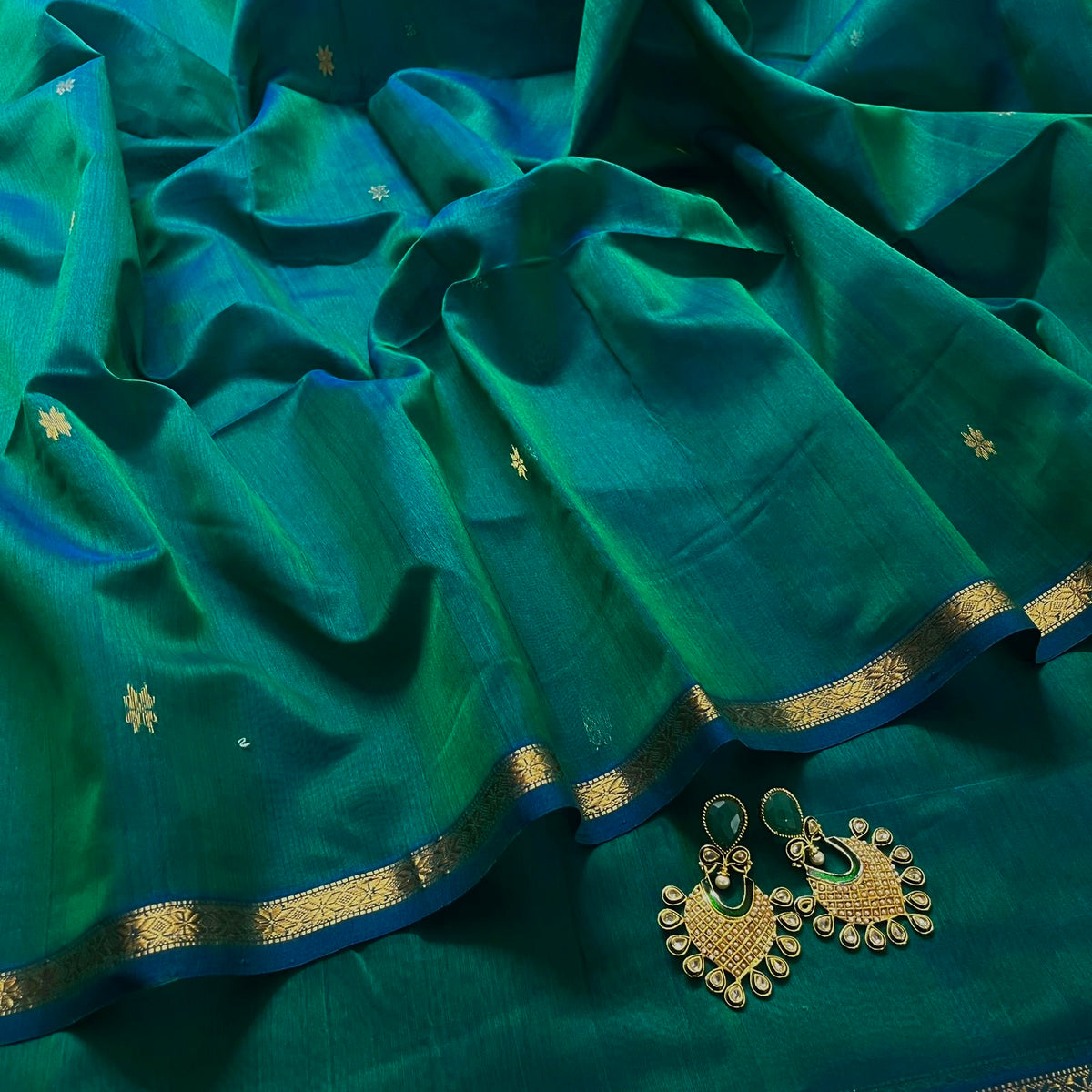 Peacock green and blue Maheshwari saree with zari border and zari bootis all over