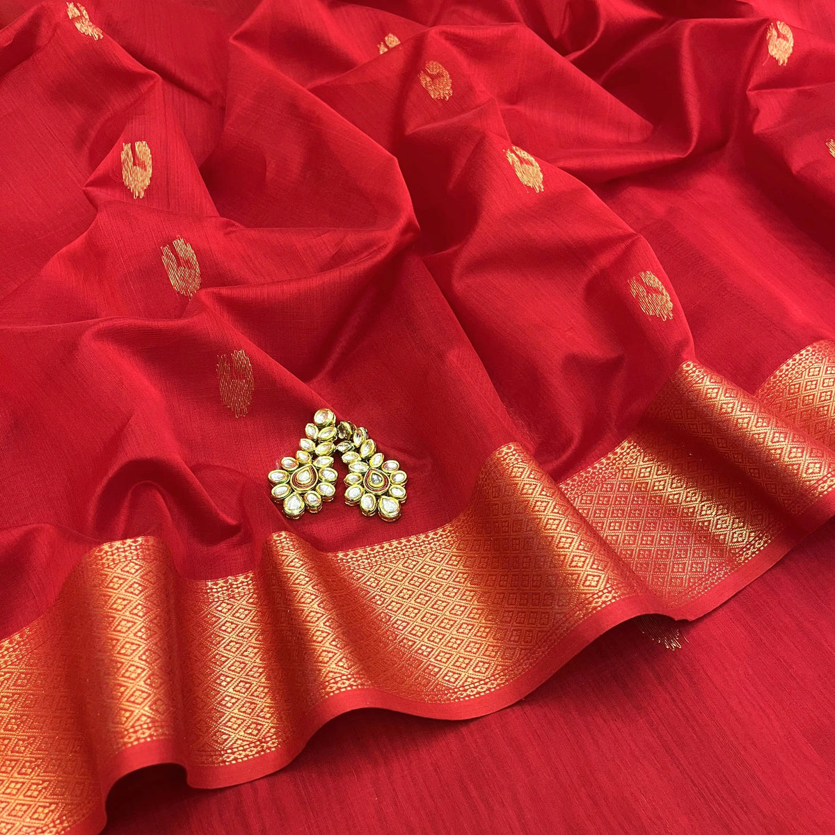 Red Maheshwari saree with morni motifs all over
