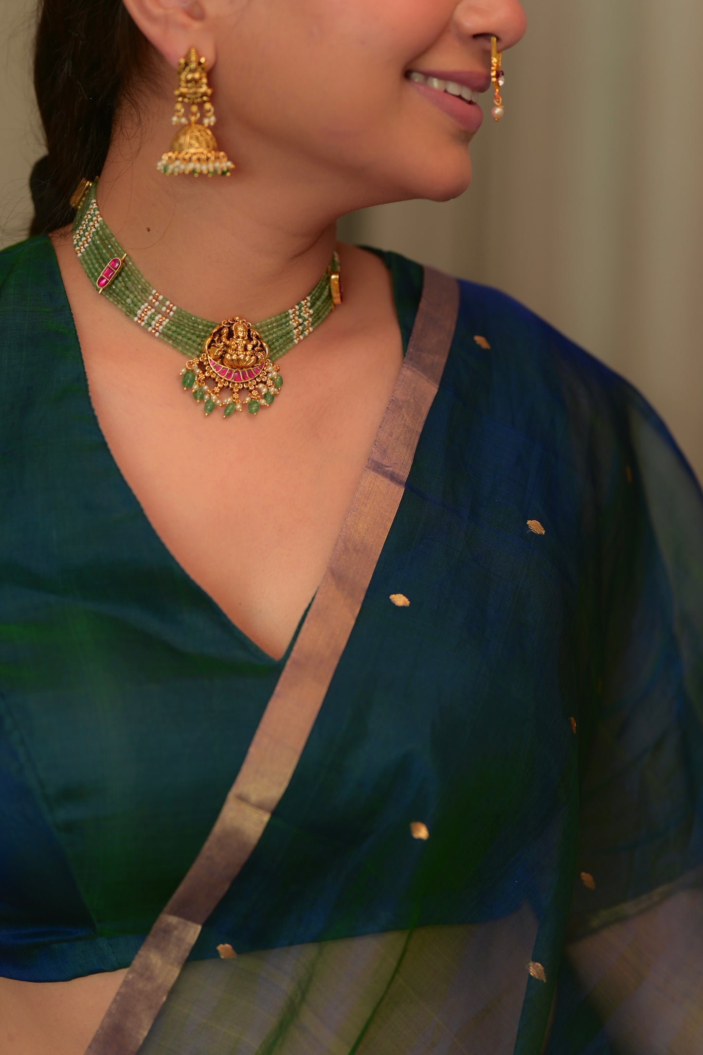 Peacock blue and green dual tone Chanderi organza silk saree with zari bootis all over