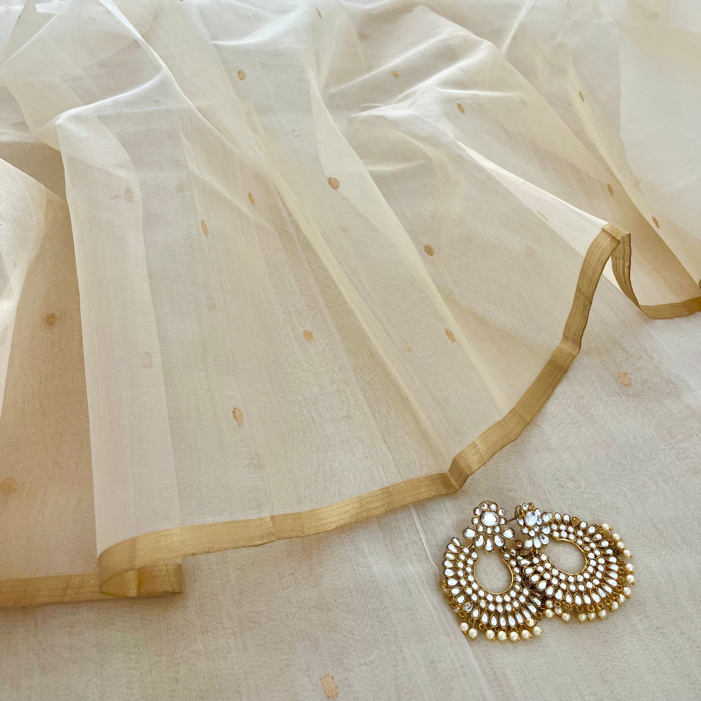 Cream Chanderi organza silk saree with zari bootis all over