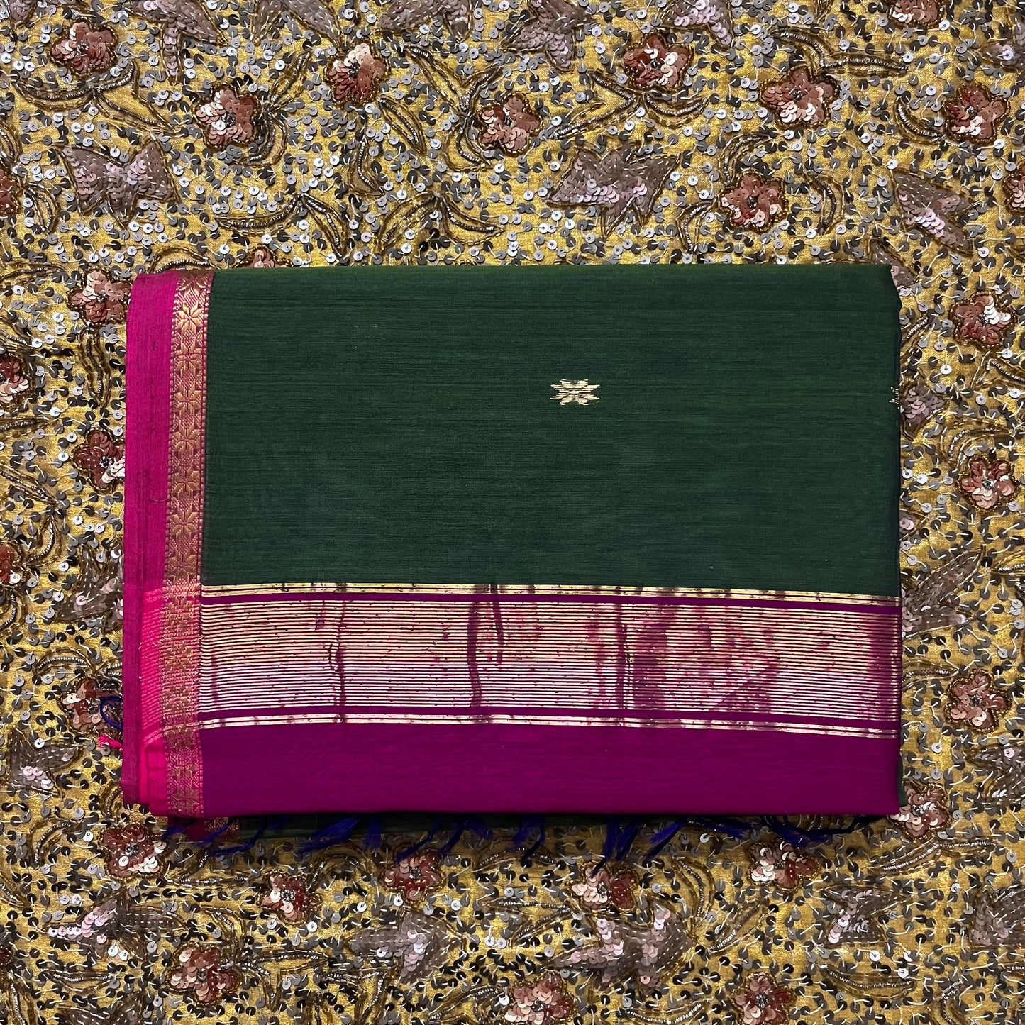 Green and pink Maheshwari saree with flower bootis all over