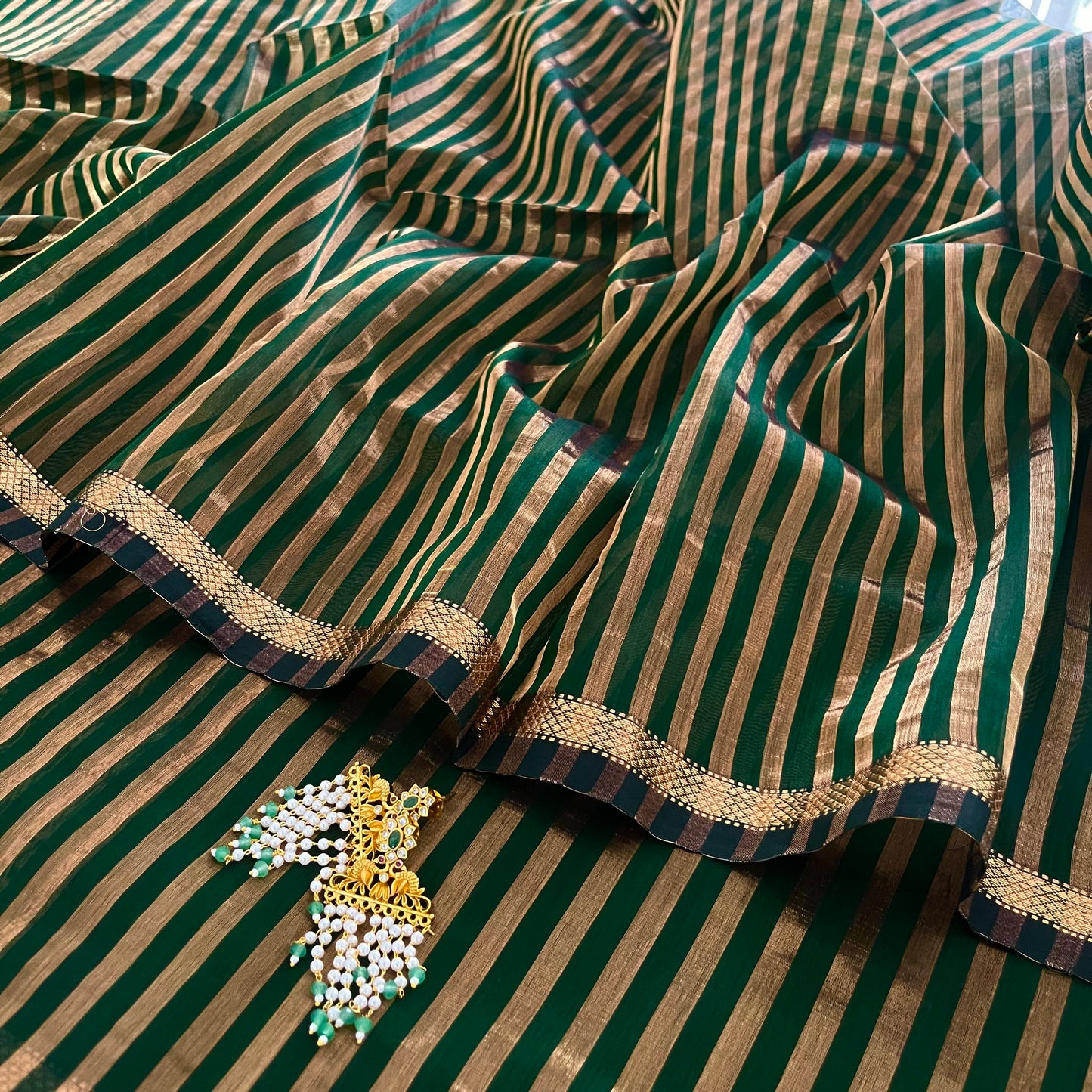 Dark green Maheshwari saree with zari stripes all over