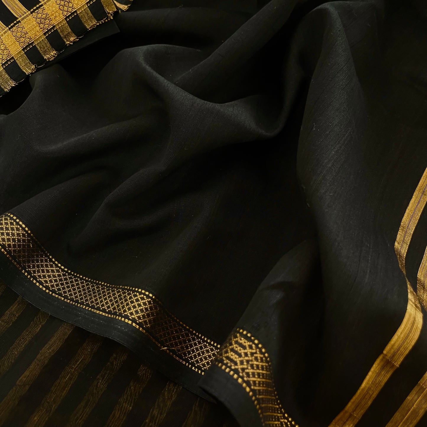 Black Maheshwari saree with zari stripes all over