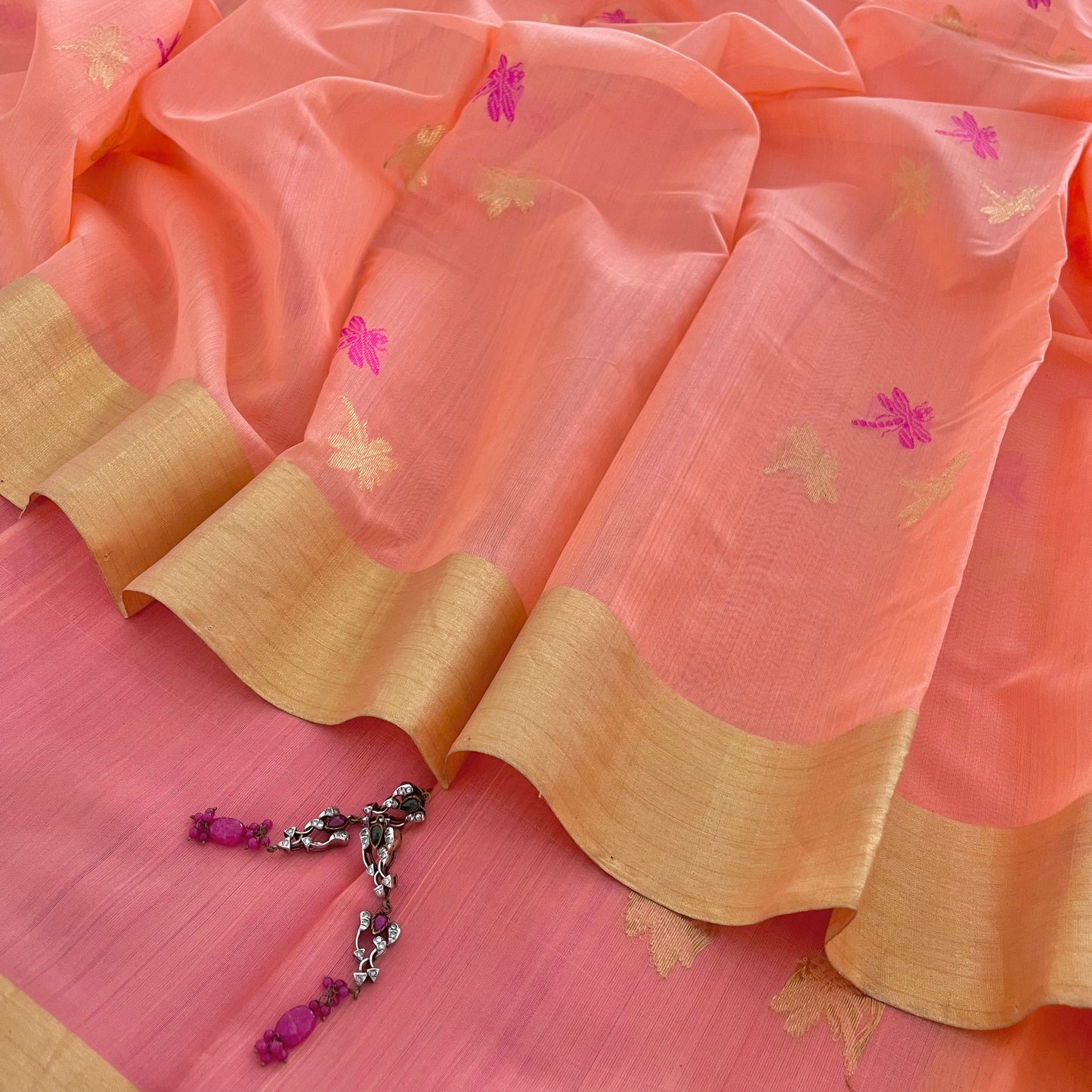 Peachish pink Chanderi silk saree with dragonfly motifs all over