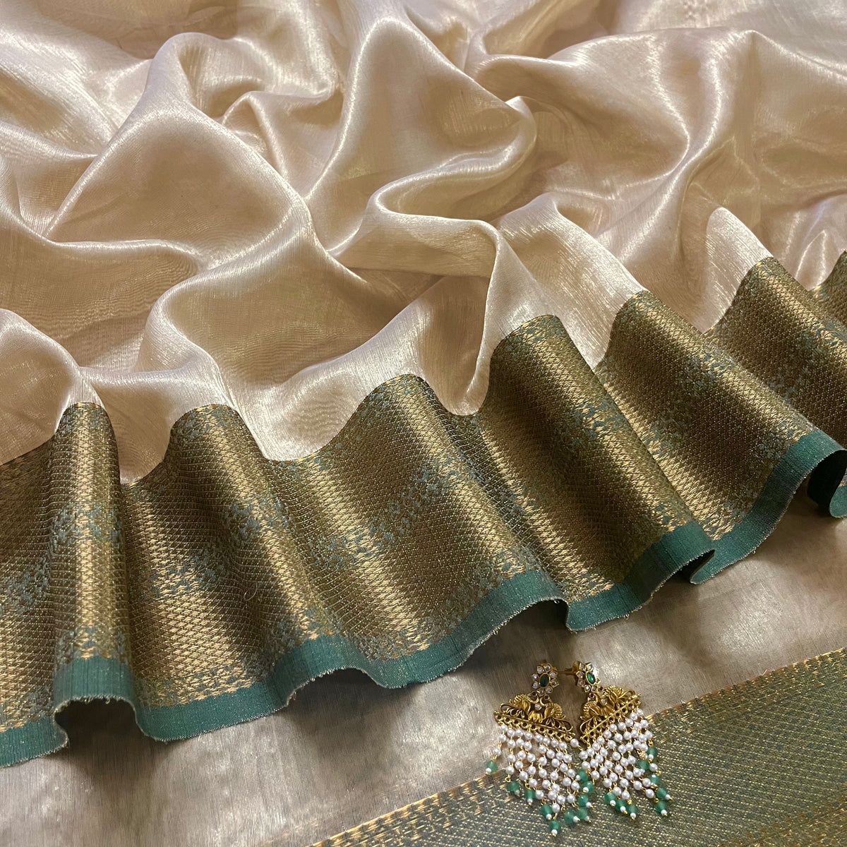Cream Gold and green Maheshwari tissue silk saree with zari pattern on pallu