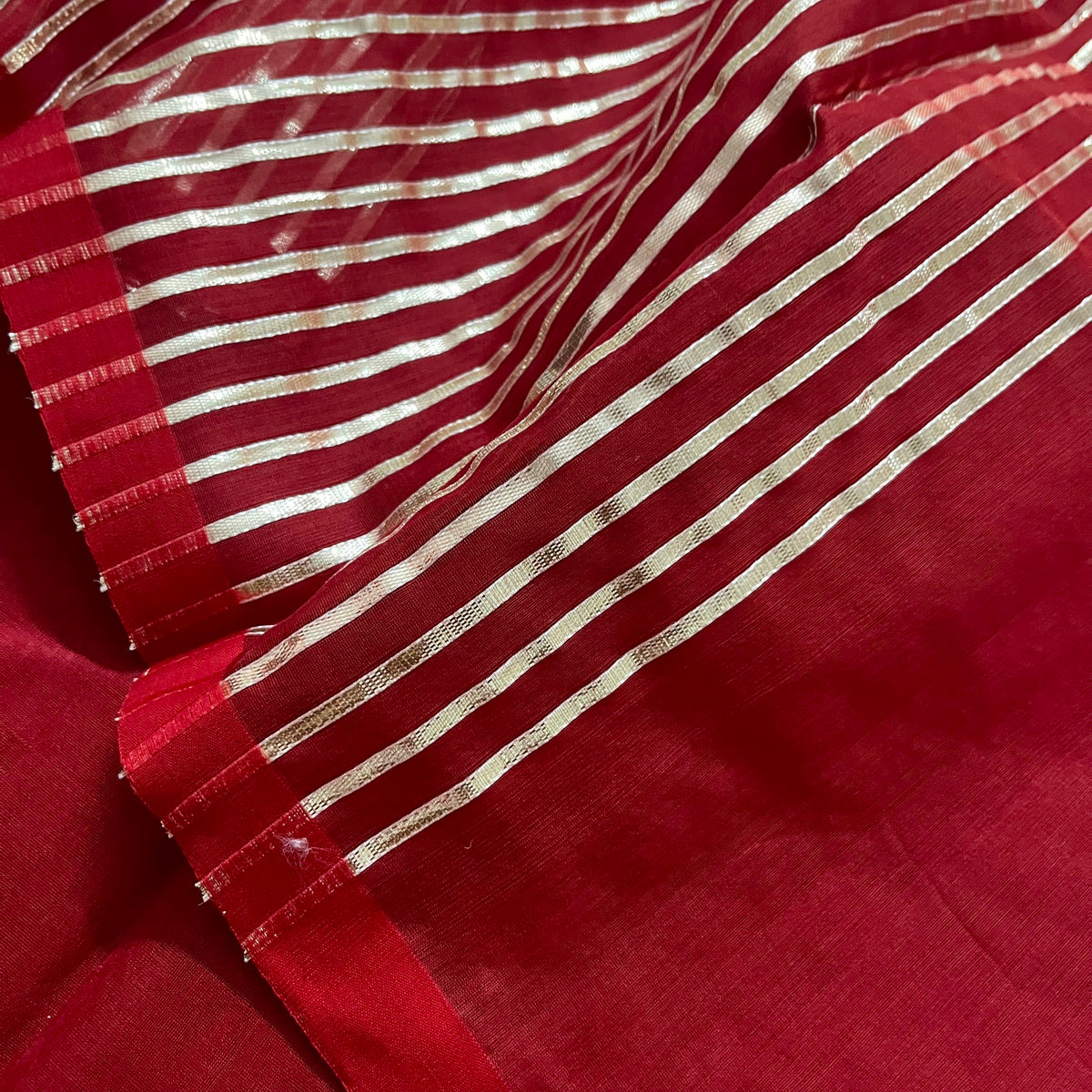 Deep red chanderi saree with intricate gota work all over