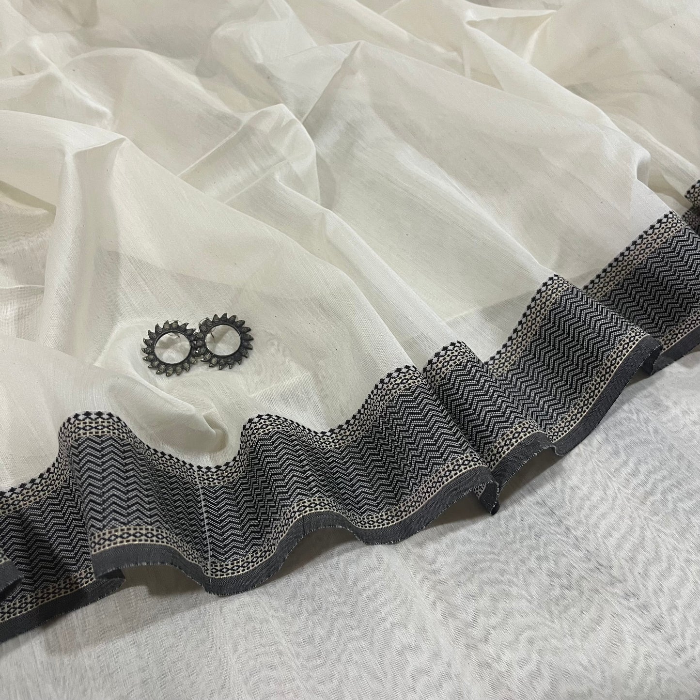 White and Black Maheshwari saree with resham border and Threadwork on pallu