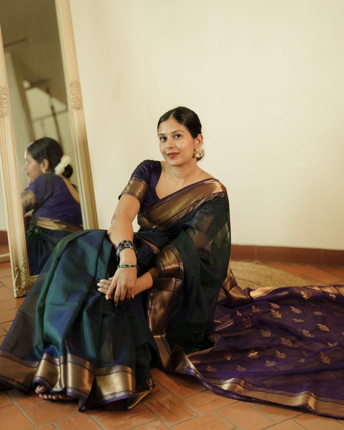 Peacock and purple dual tone Maheshwari saree with flower motifs on pallu