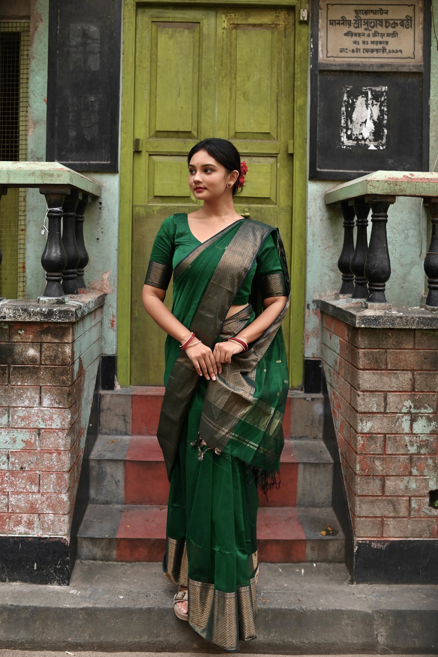 Dark green maheshwari with saree with flower bootis all over