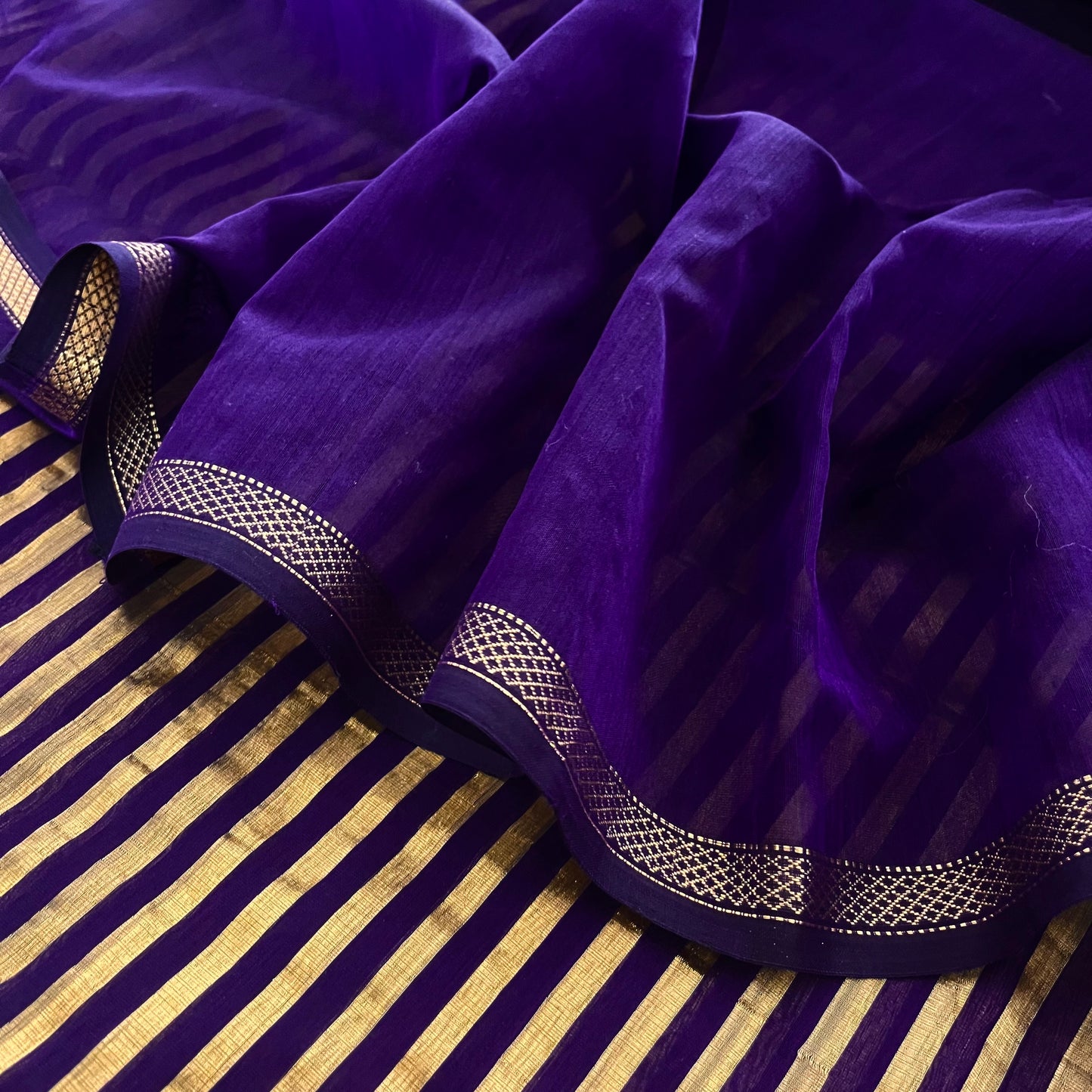 Dark purple and gold Maheshwari saree with zari stripes all over