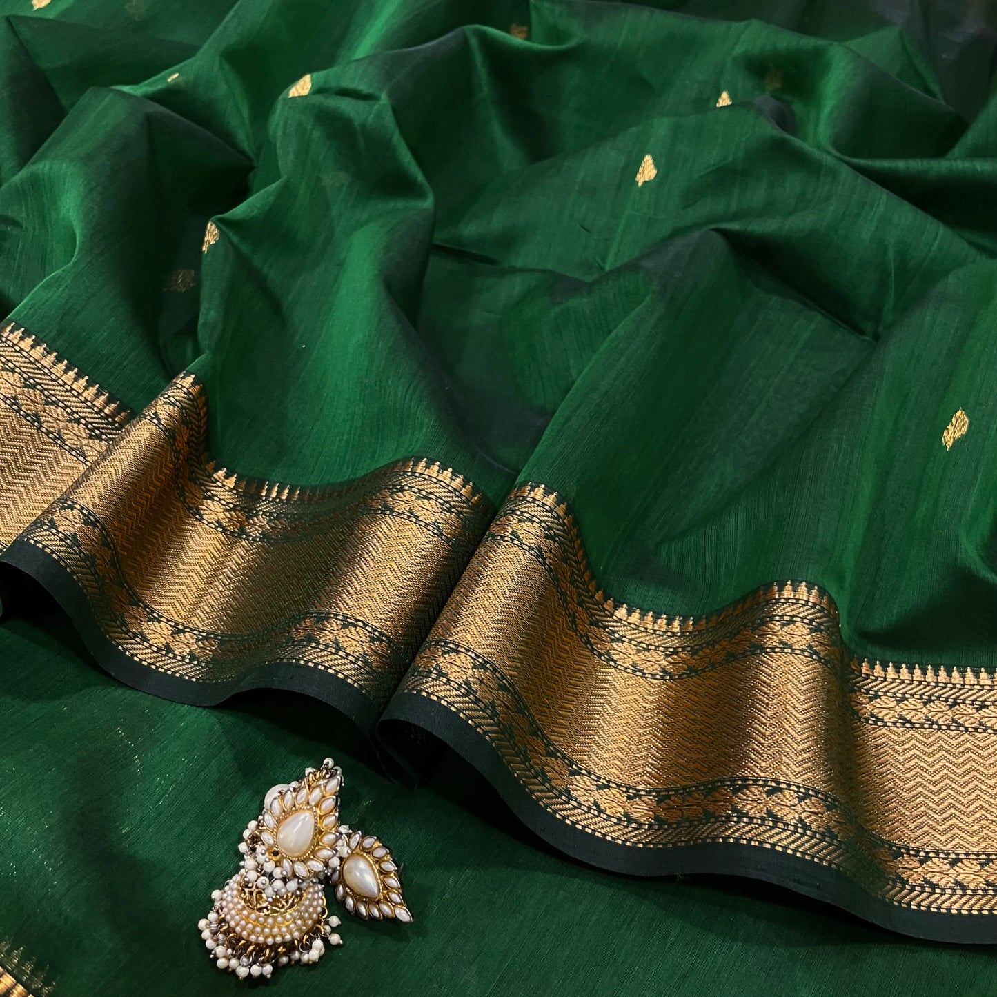 Bottle green Maheshwari saree with zari bootis and zari border