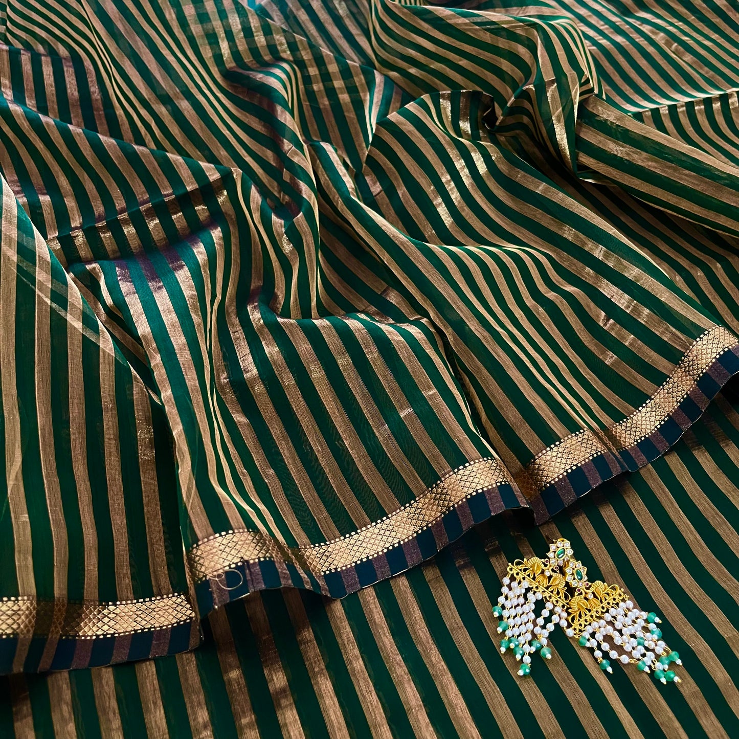 Dark green Maheshwari saree with zari stripes all over
