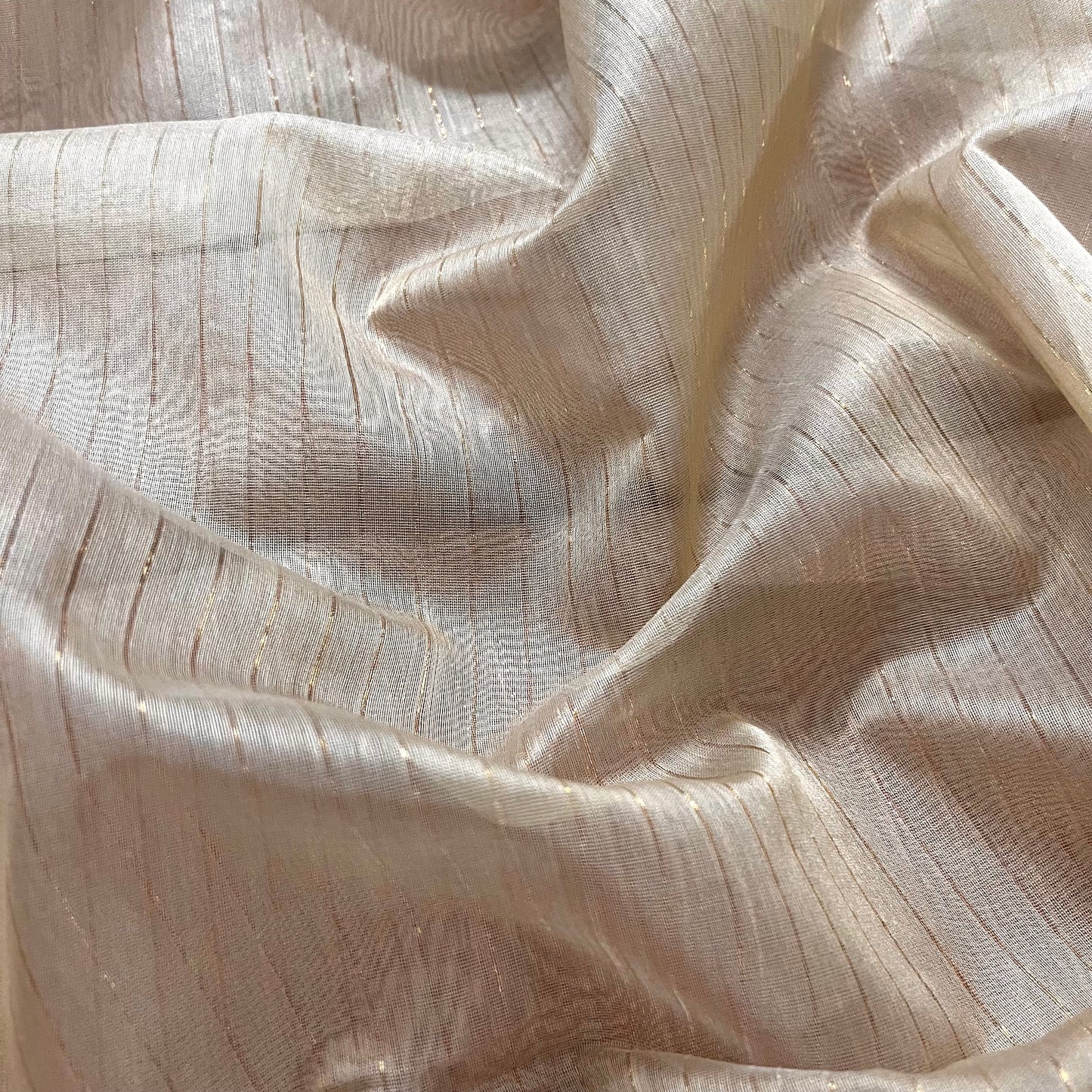 Light beige and red Maheshwari saree with zari lines all over