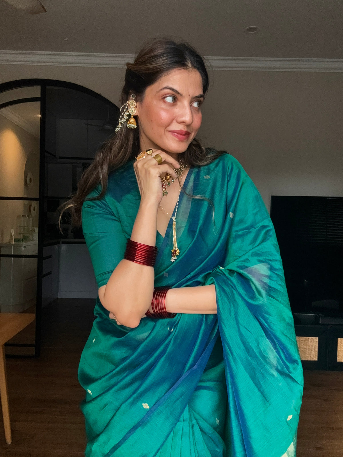 Peacock green and blue dual tone Maheshwari saree with zari bootis all over
