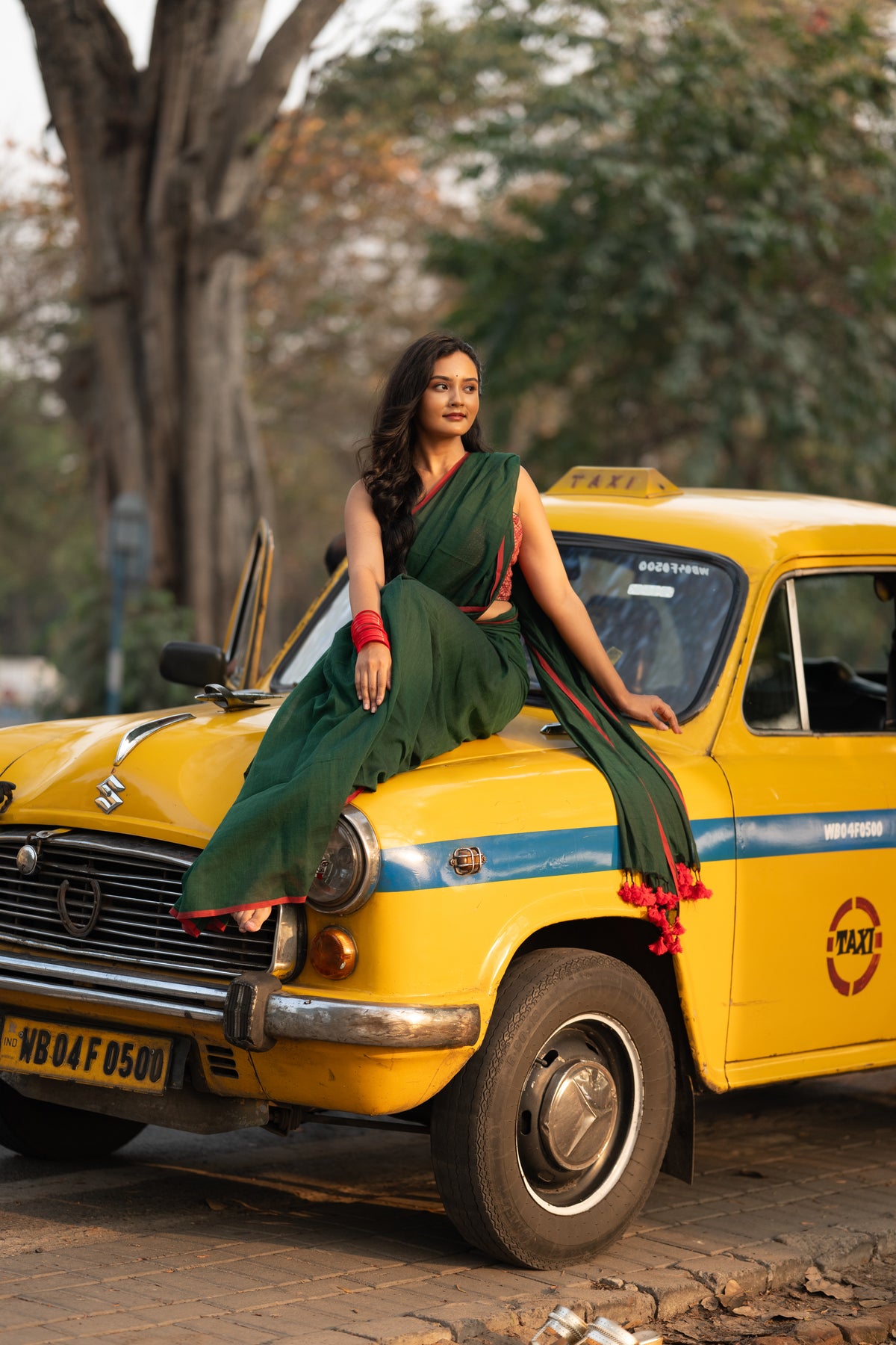 Dark green and red mulmul saree