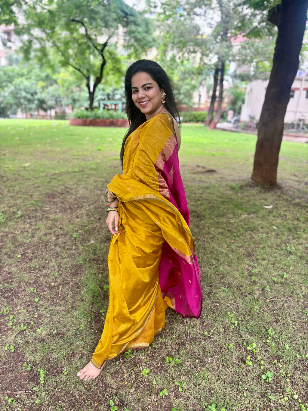 Mustard and pink maheshwari saree with flower bootis all over