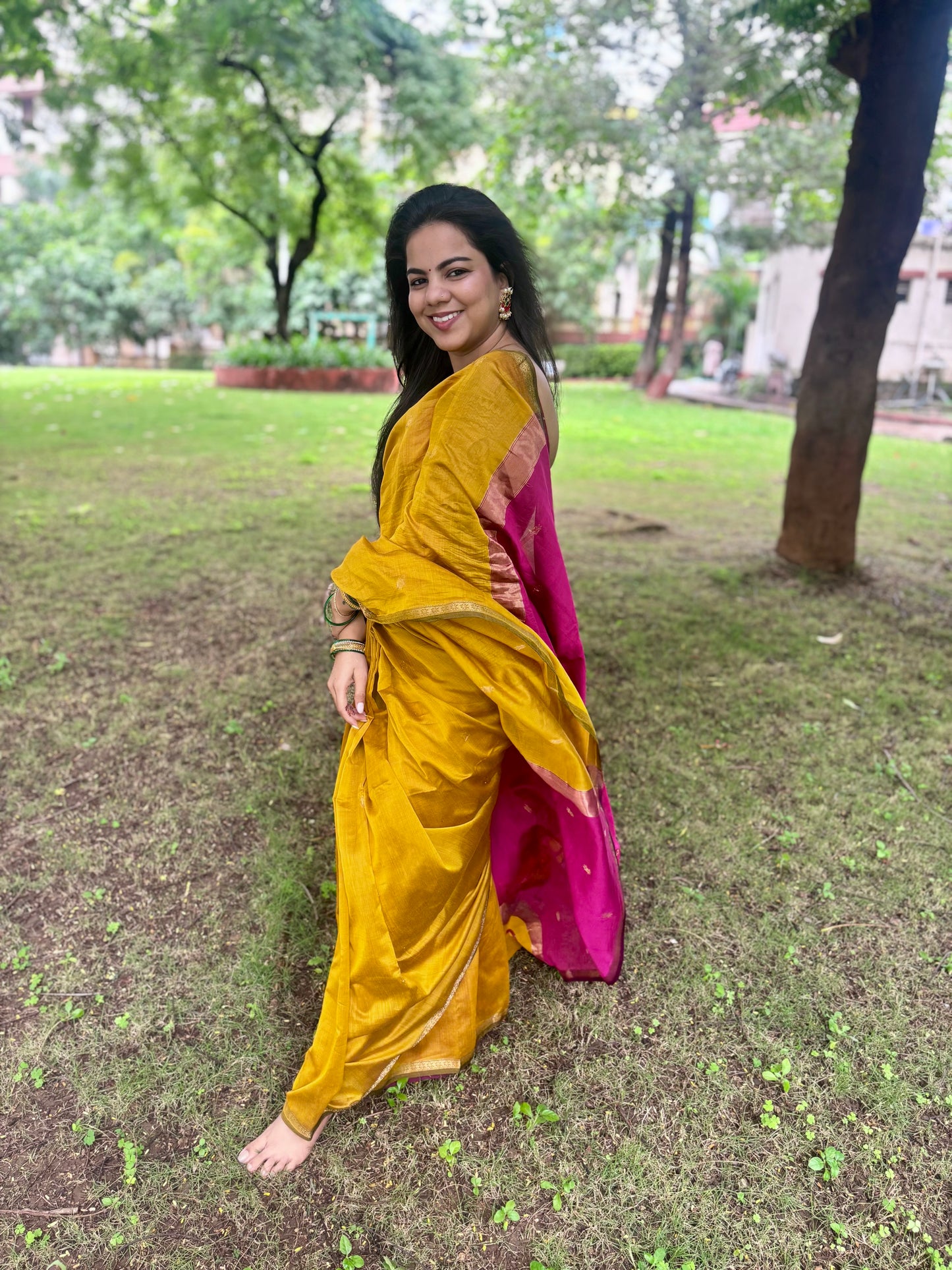 Mustard and pink maheshwari saree with flower bootis all over