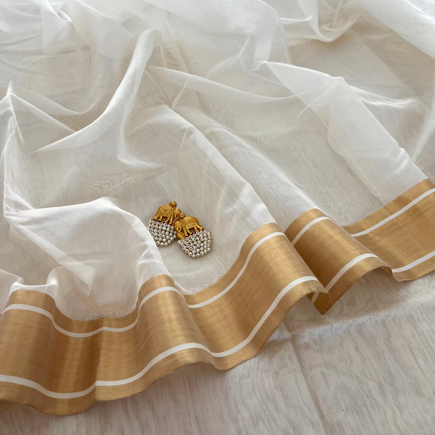 Off white Chanderi saree with zari border