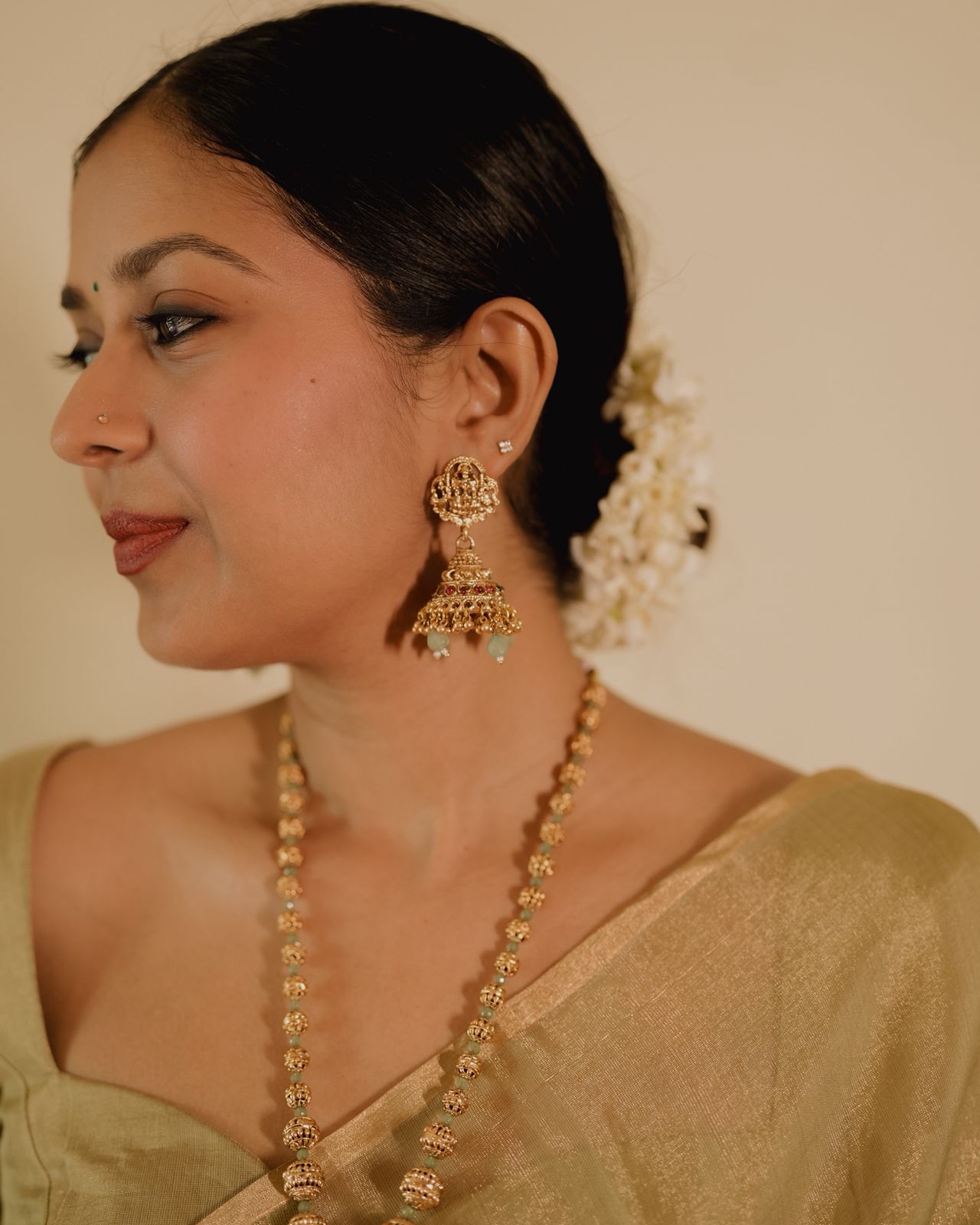 Olive gold Maheshwari tissue silk saree with zari bootis all over