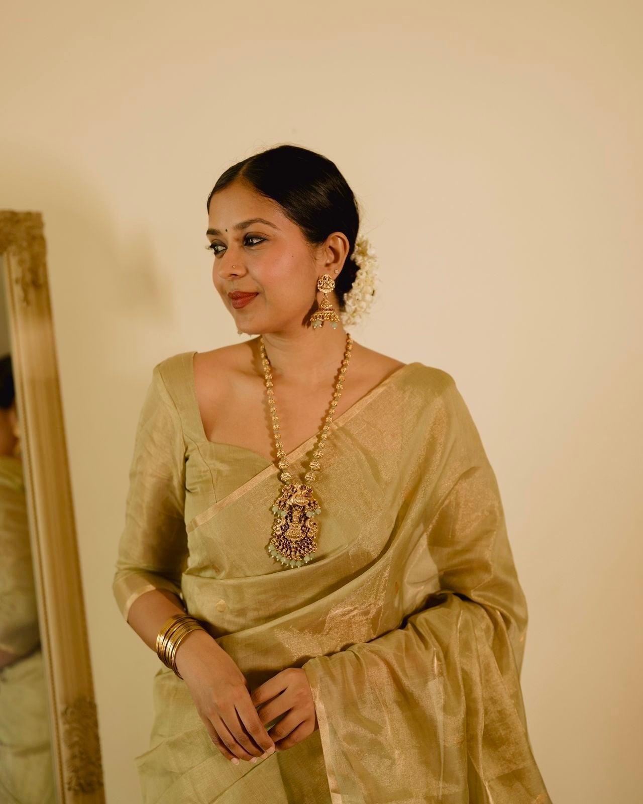 Olive gold Maheshwari tissue silk saree with zari bootis all over